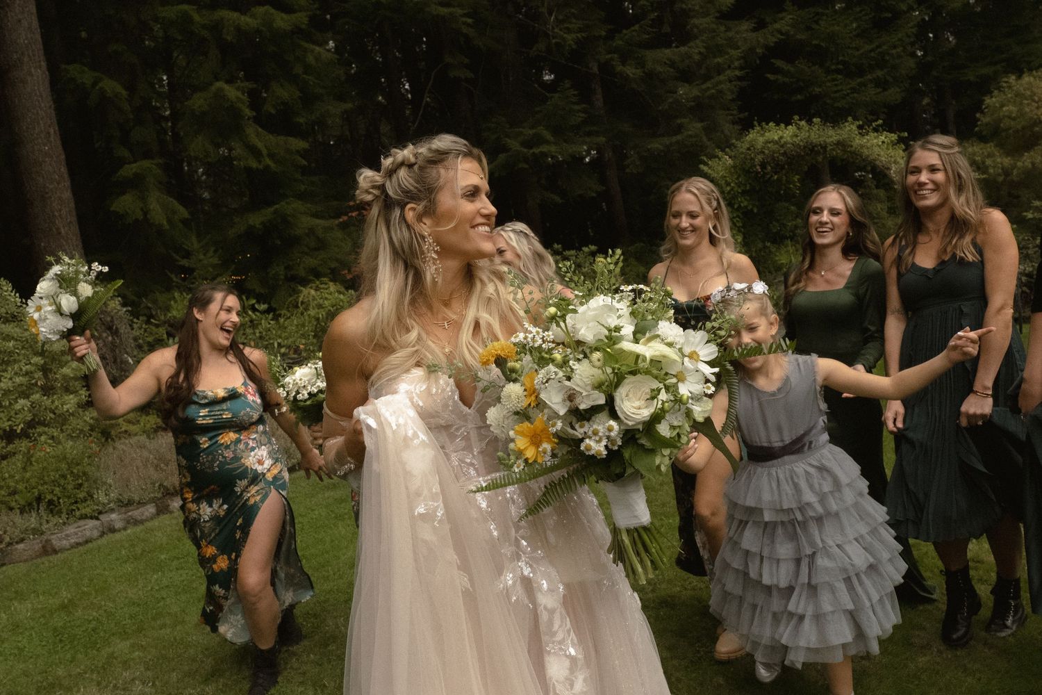 a bride with bridal party and family, smiling, family portraits