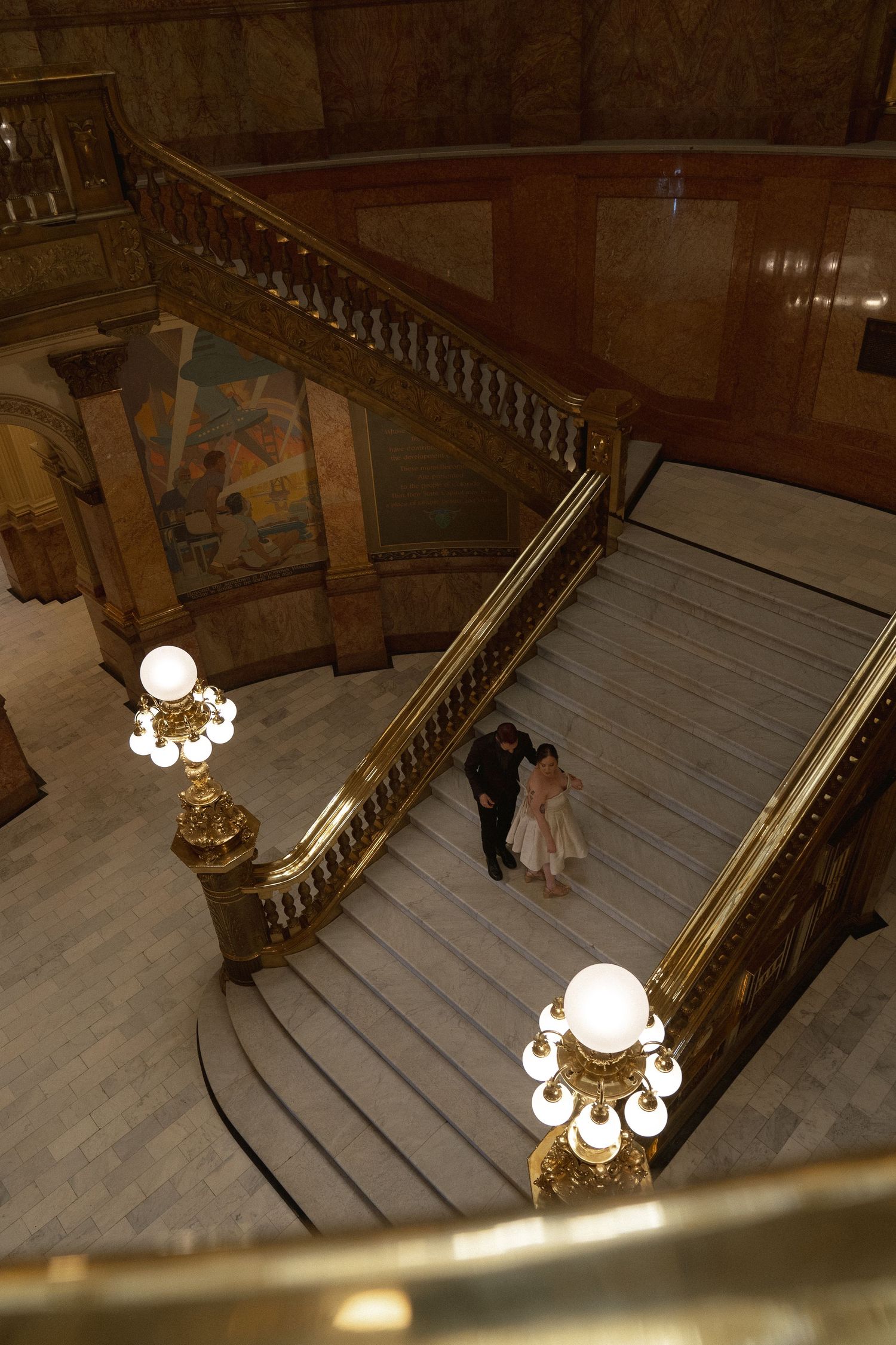 a couple walking down the stairs,