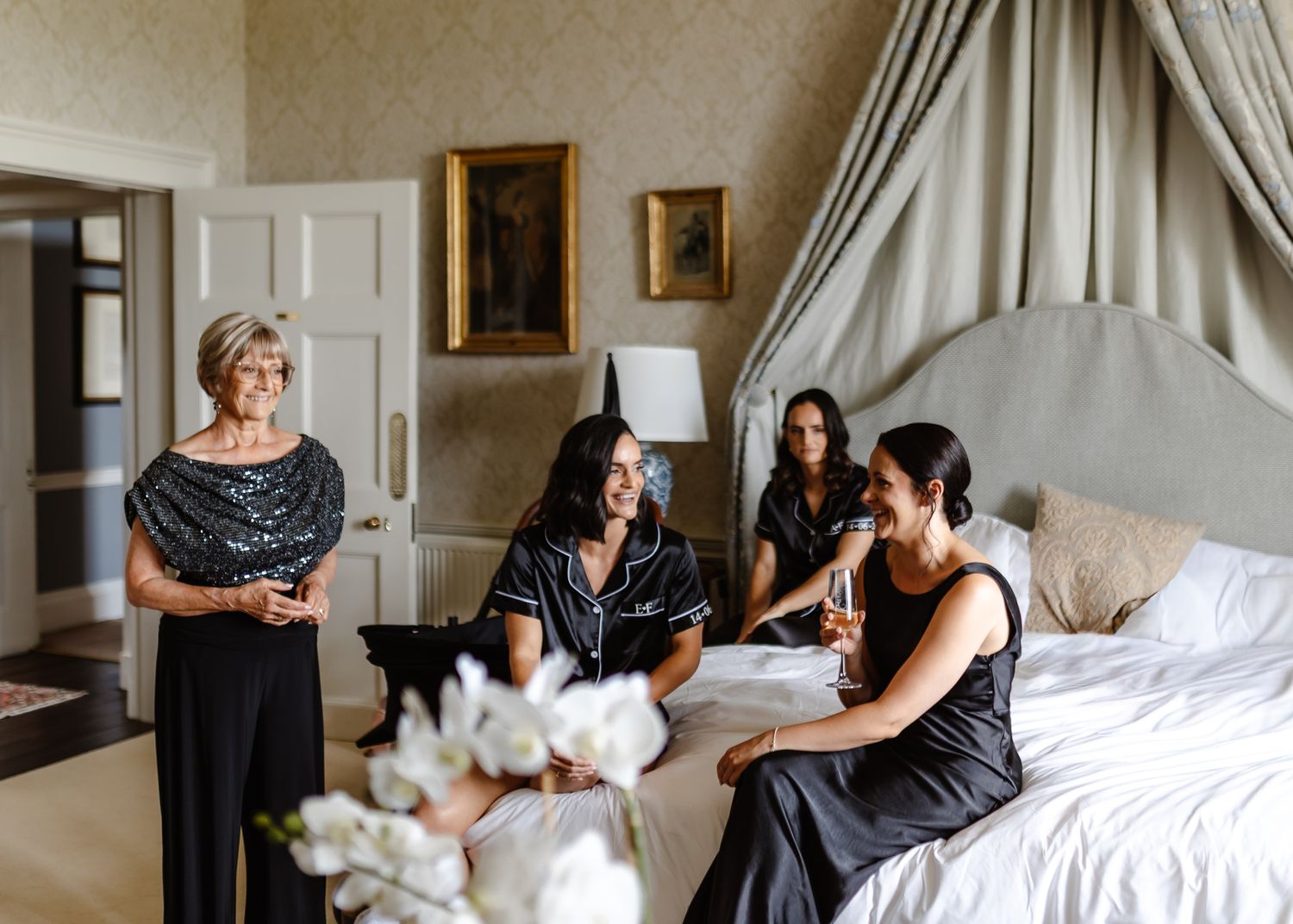 A sequence of getting ready photos showing wedding preparations in an elegant room with white curtains and furnishings.