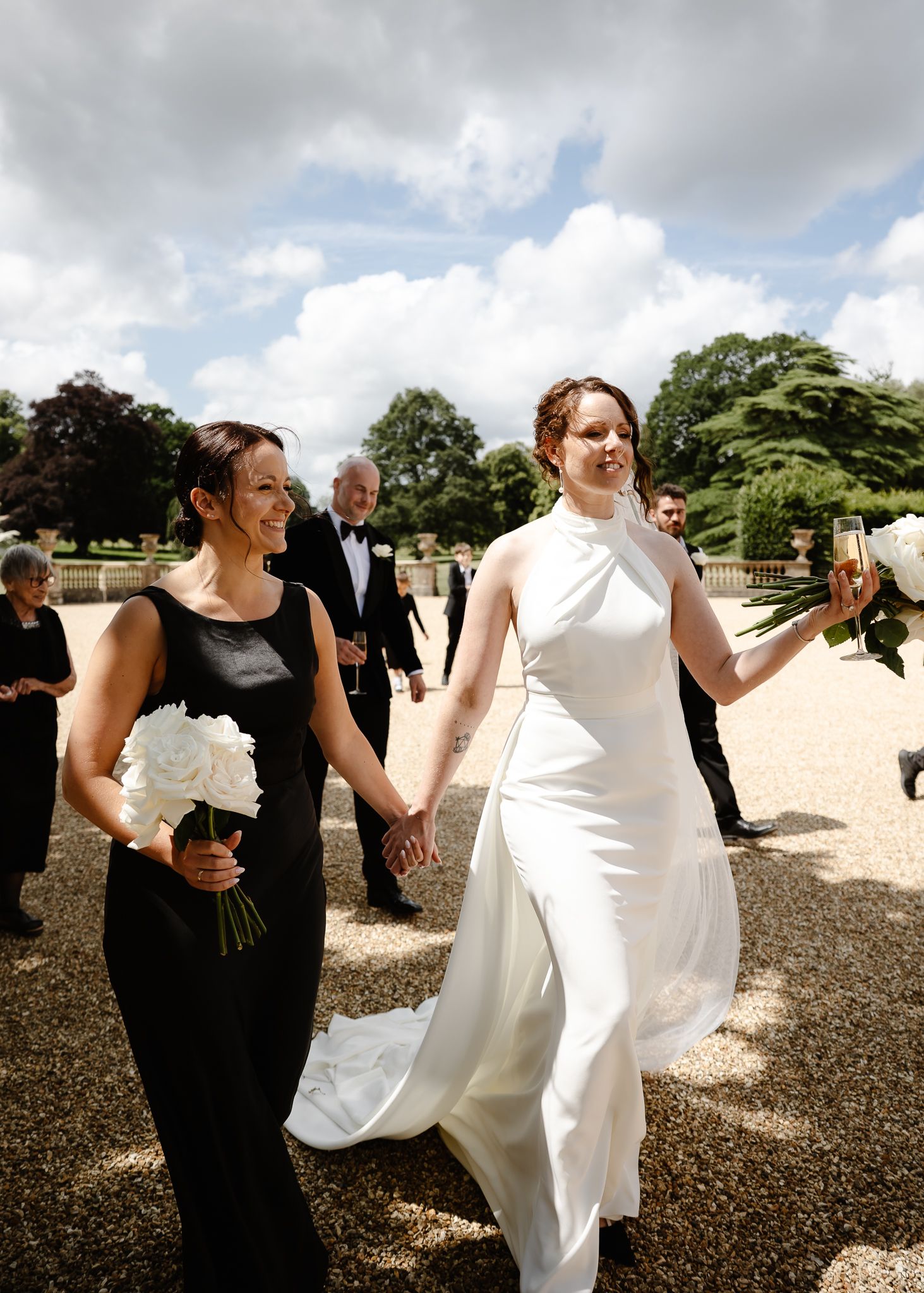 A series of candid wedding photos showing playful moments between a couple in white dress and black attire outdoors.