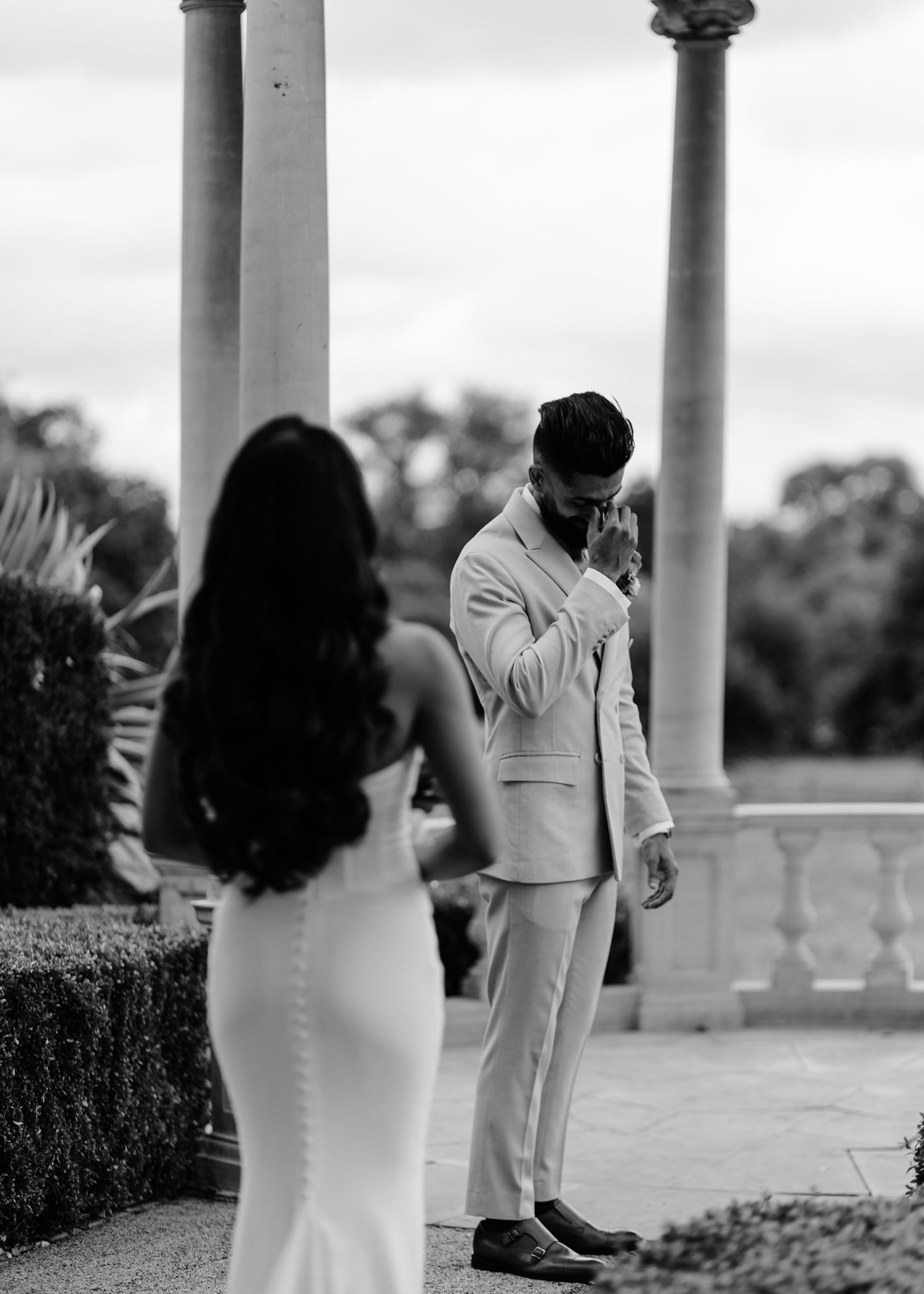 A romantic black and white photo sequence shows a couple dancing together on a columned patio.