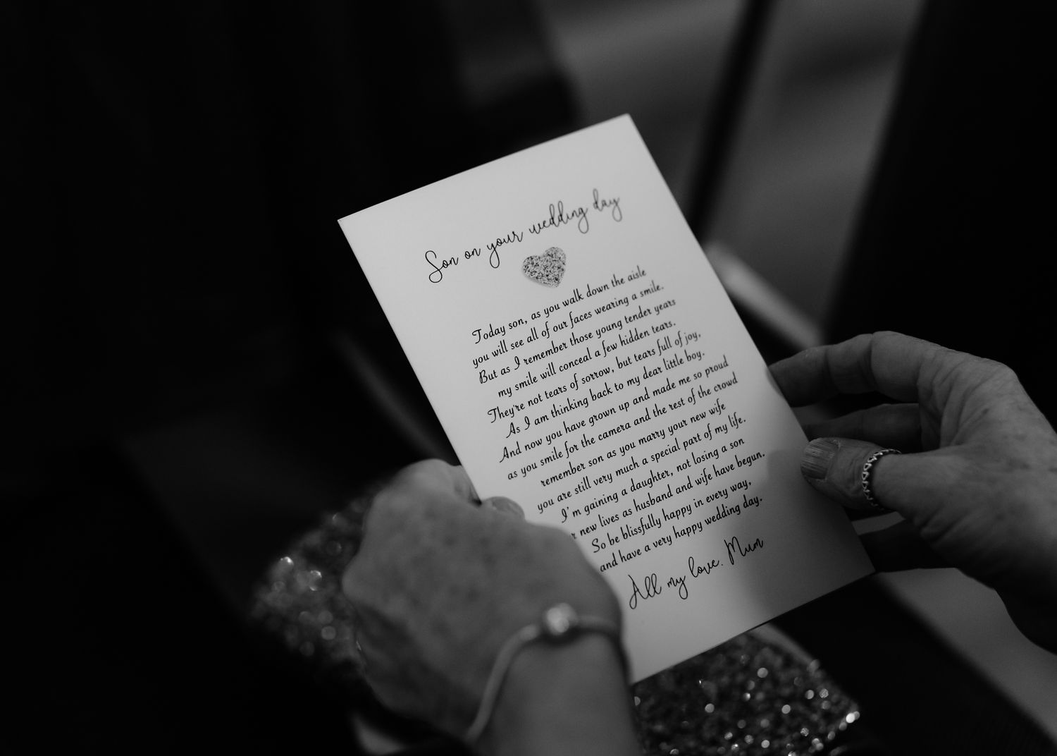 A series of hands holding handwritten notes and letters in black and white.