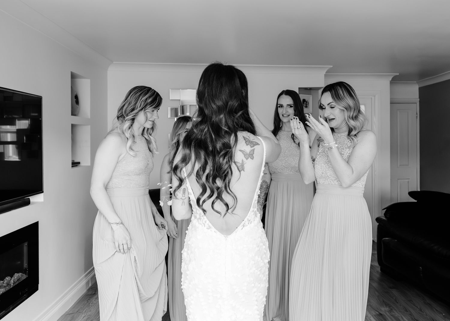 Black and white photo collage showing bridesmaids in matching robes preparing for a wedding celebration.