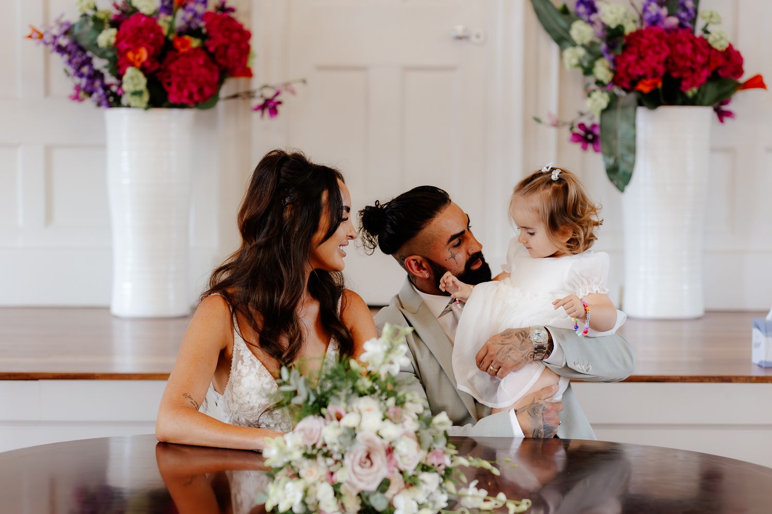 Romantic wedding moments captured in a series of intimate photos showing couples embracing and dancing in a light-filled room.