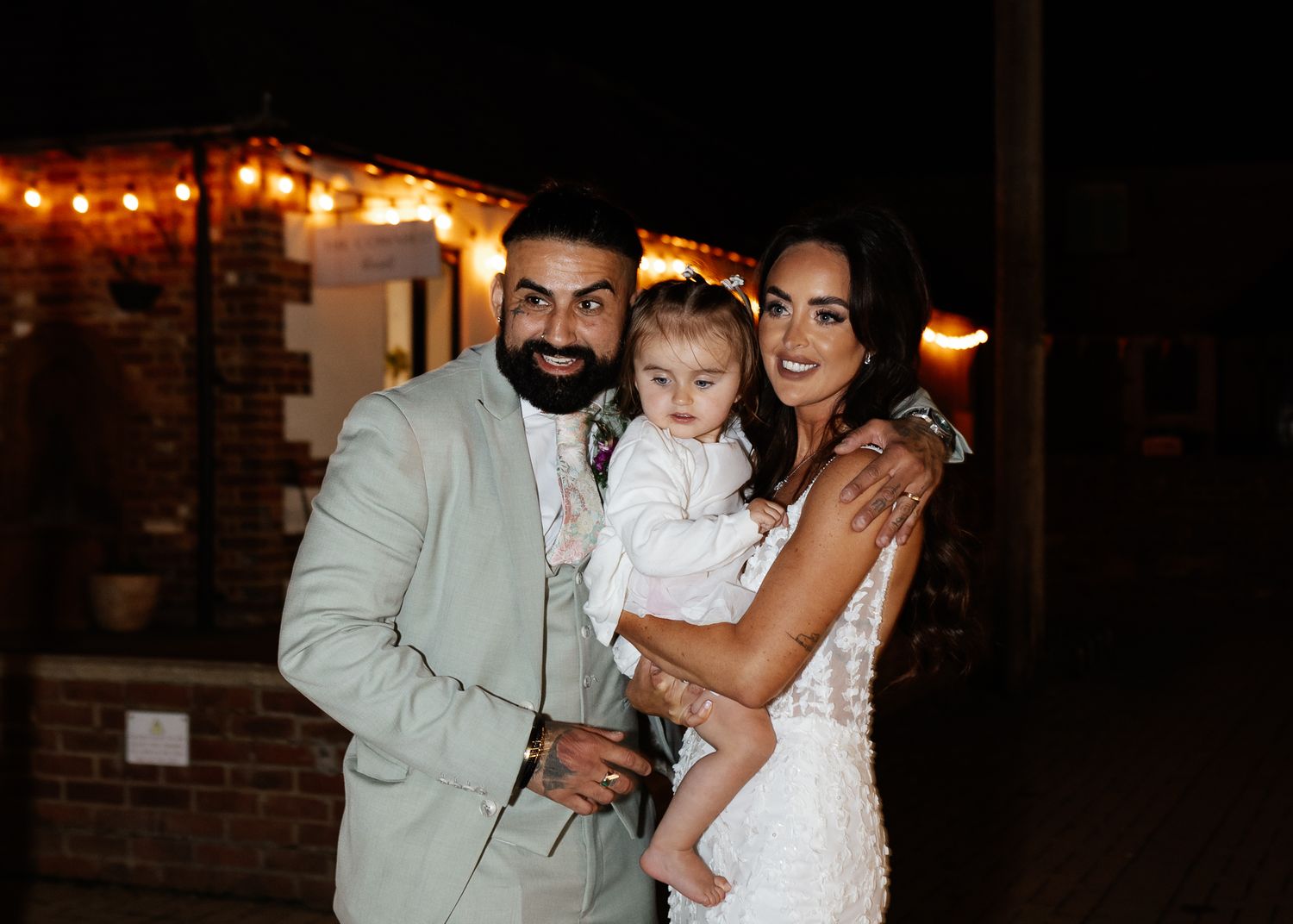 A series of wedding photos showing intimate moments between couples and family members in a dimly lit venue.