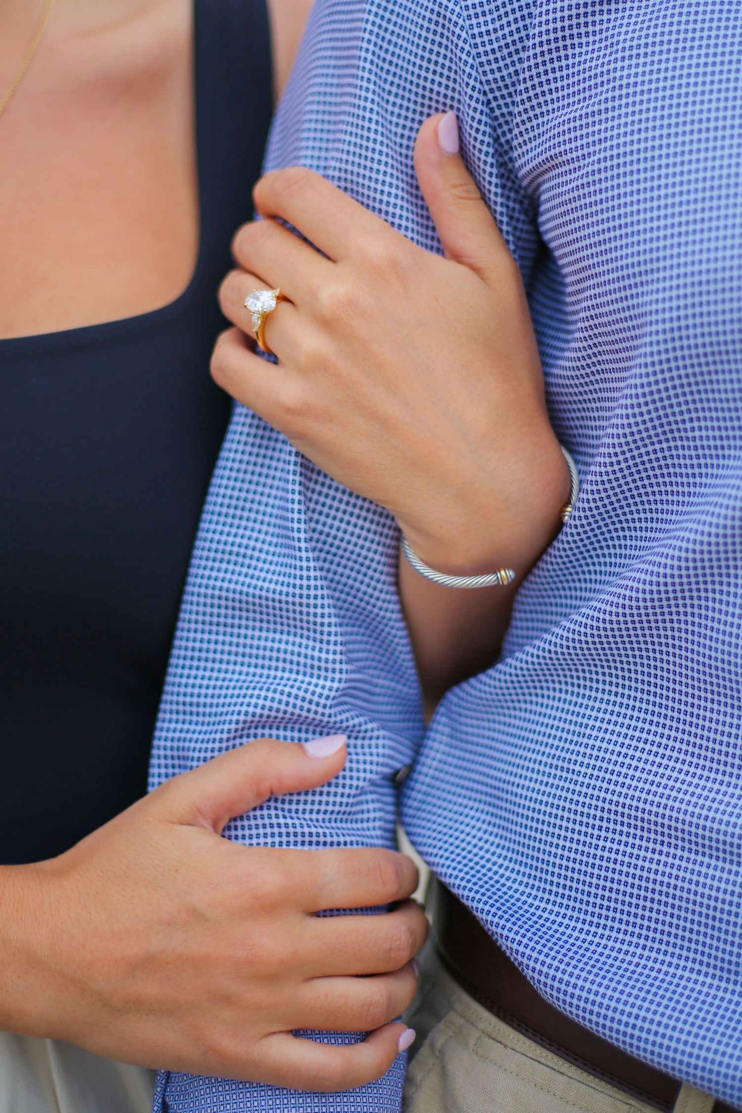 Sequence showing tender moments between a couple with hands on shoulders and embracing.
