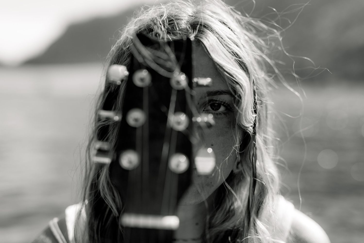 Brewster High School senior posing with her guitar on Alta Lake in north-central Washington before the start of summer.