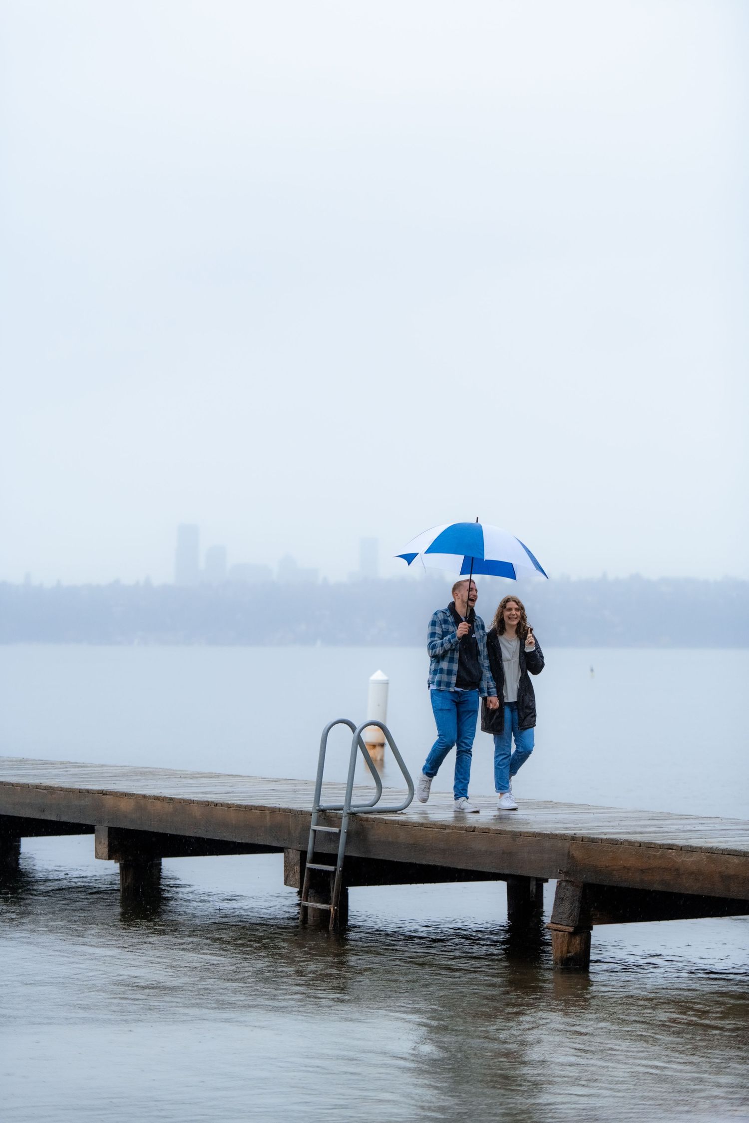 Moody engagement photos in Redmond, Washington on a rainy evening with film.