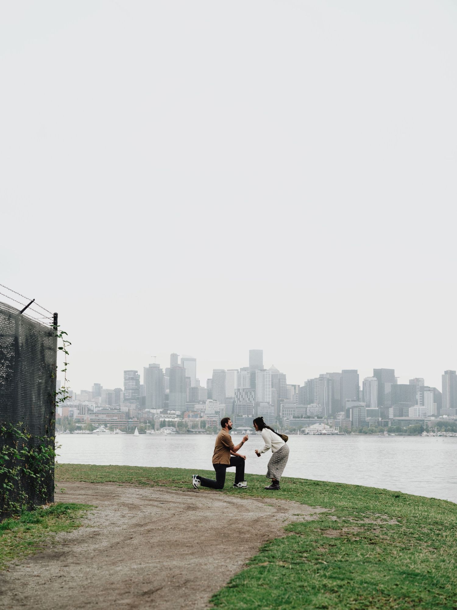 Moody engagement photos in Seattle, Washington at Gas Works Park on a foggy morning with film.
