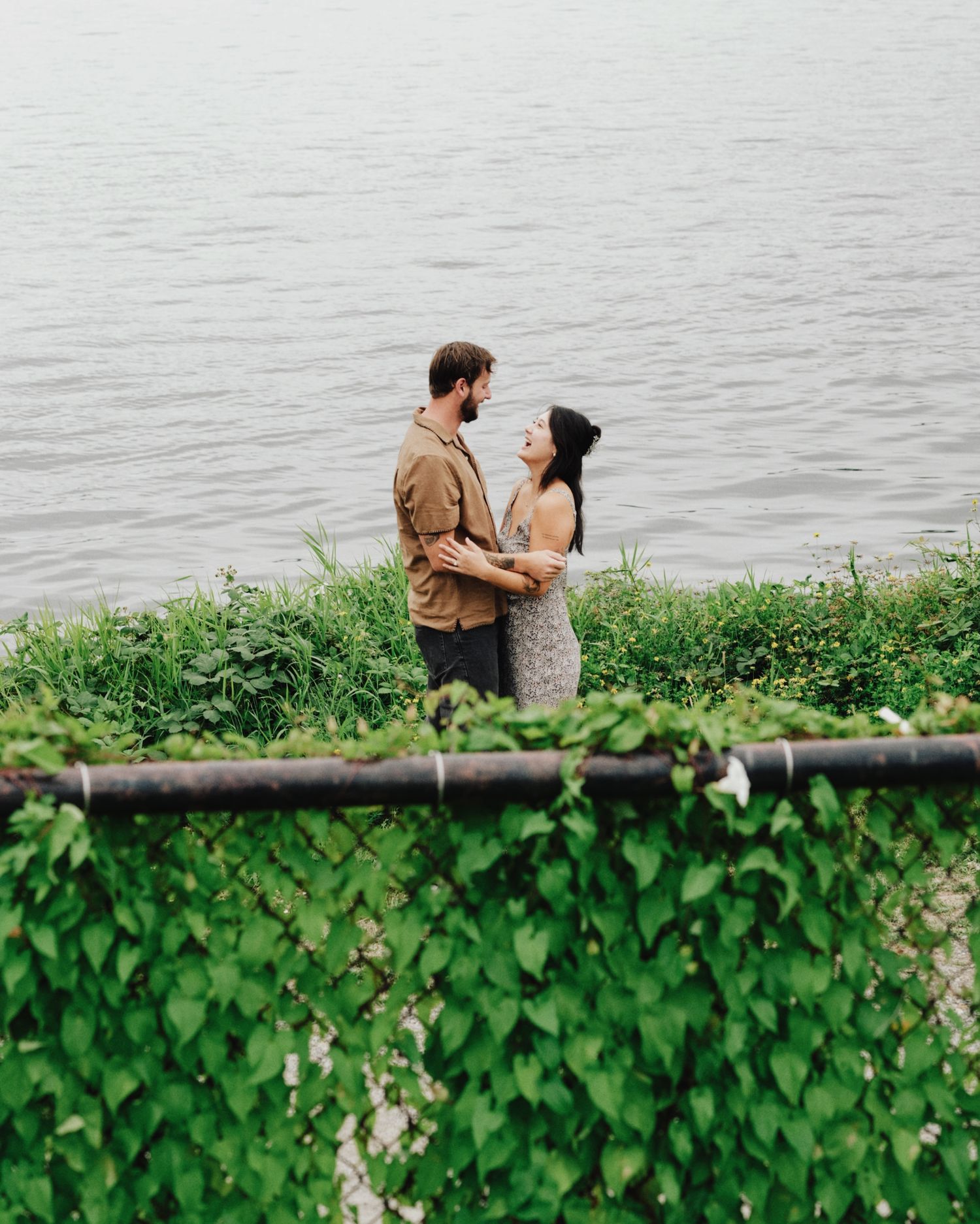 Moody engagement photos in Seattle, Washington on a rainy afternoon with film under the Space Needle.