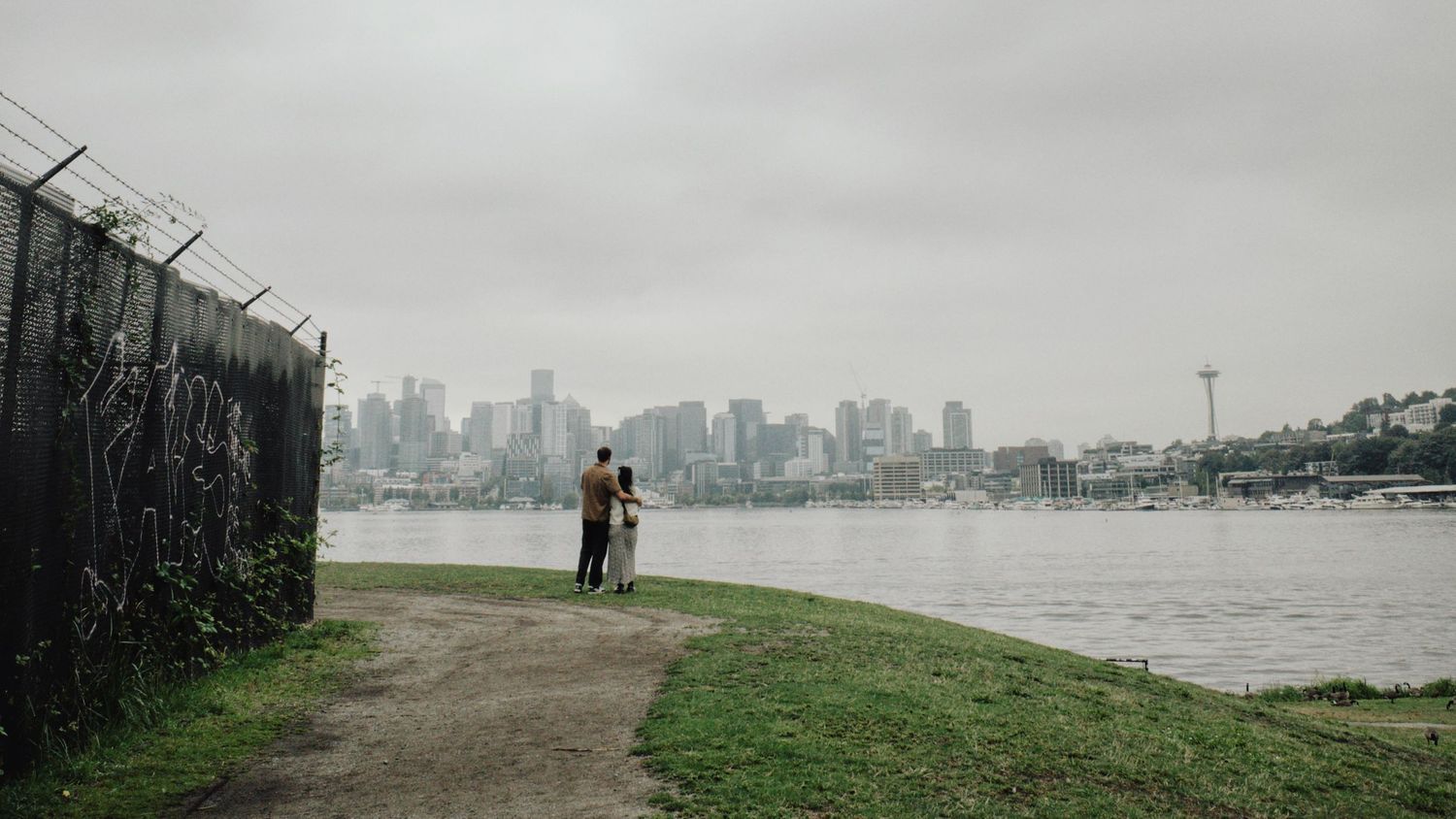 Moody engagement photos in Seattle, Washington at Gas Works Park on a foggy morning with film.