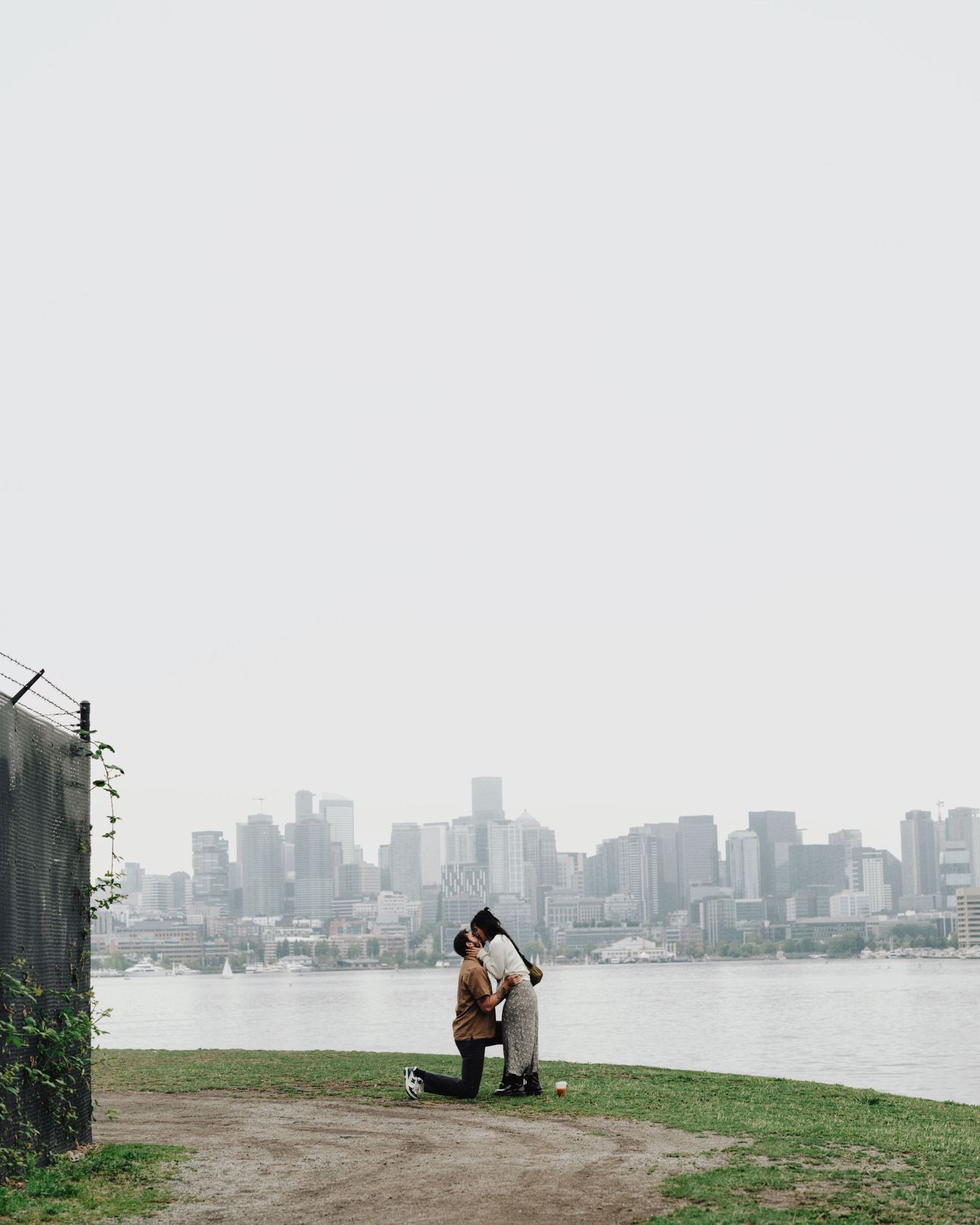 Moody engagement photos in Seattle, Washington at Gas Works Park on a foggy morning with film.