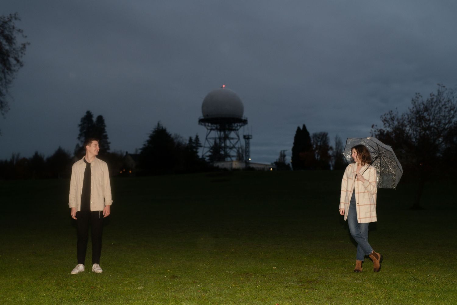 Moody engagement photos in Seattle, Washington on a rainy evening with film.