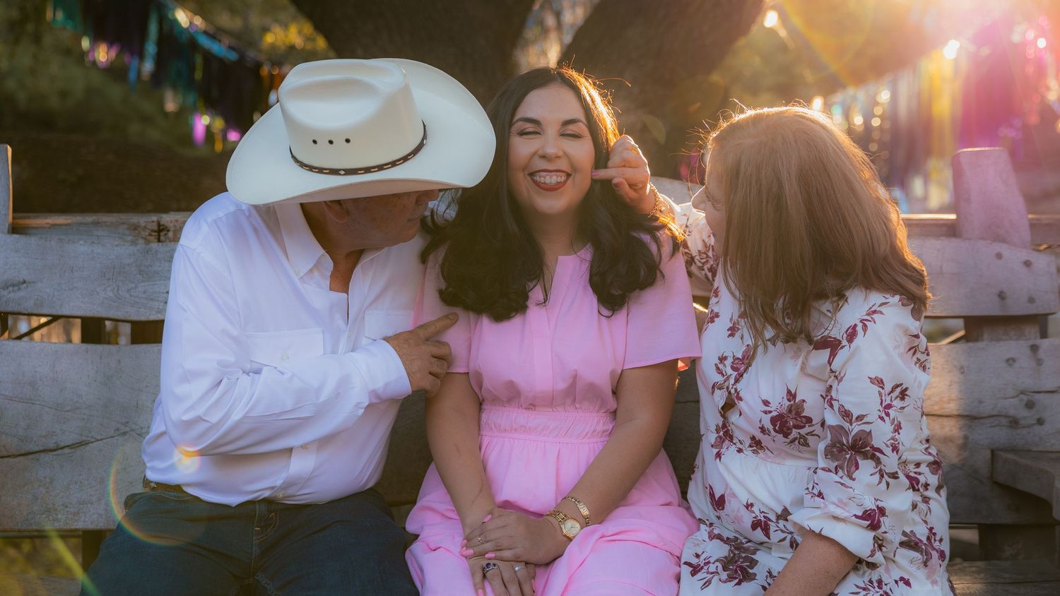 A romantic sunset photoshoot with a couple dancing and embracing outdoors.