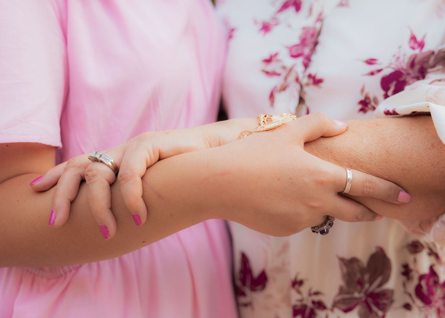 Close-up shots of hands with rings showing emotional connection and jewelry details.