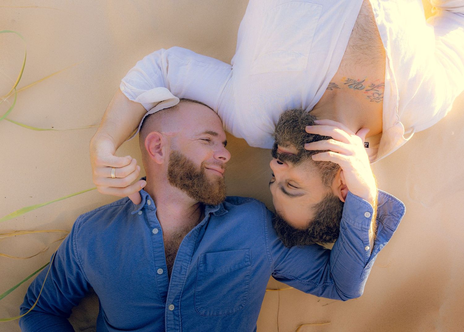 Intimate couple photos with soft lighting against neutral background.