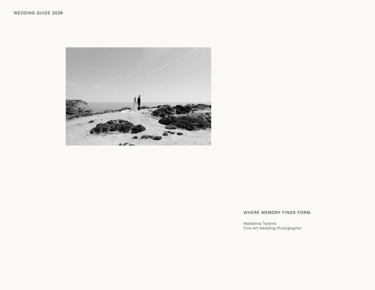 Black and white photo of a couple standing on rocky coastal terrain for their fine art wedding photography session.