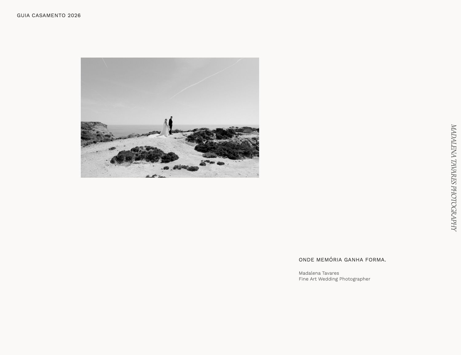 Black and white photo of a couple standing on a rocky beach, featured in a 2018 wedding guide by Fine Art photographer.