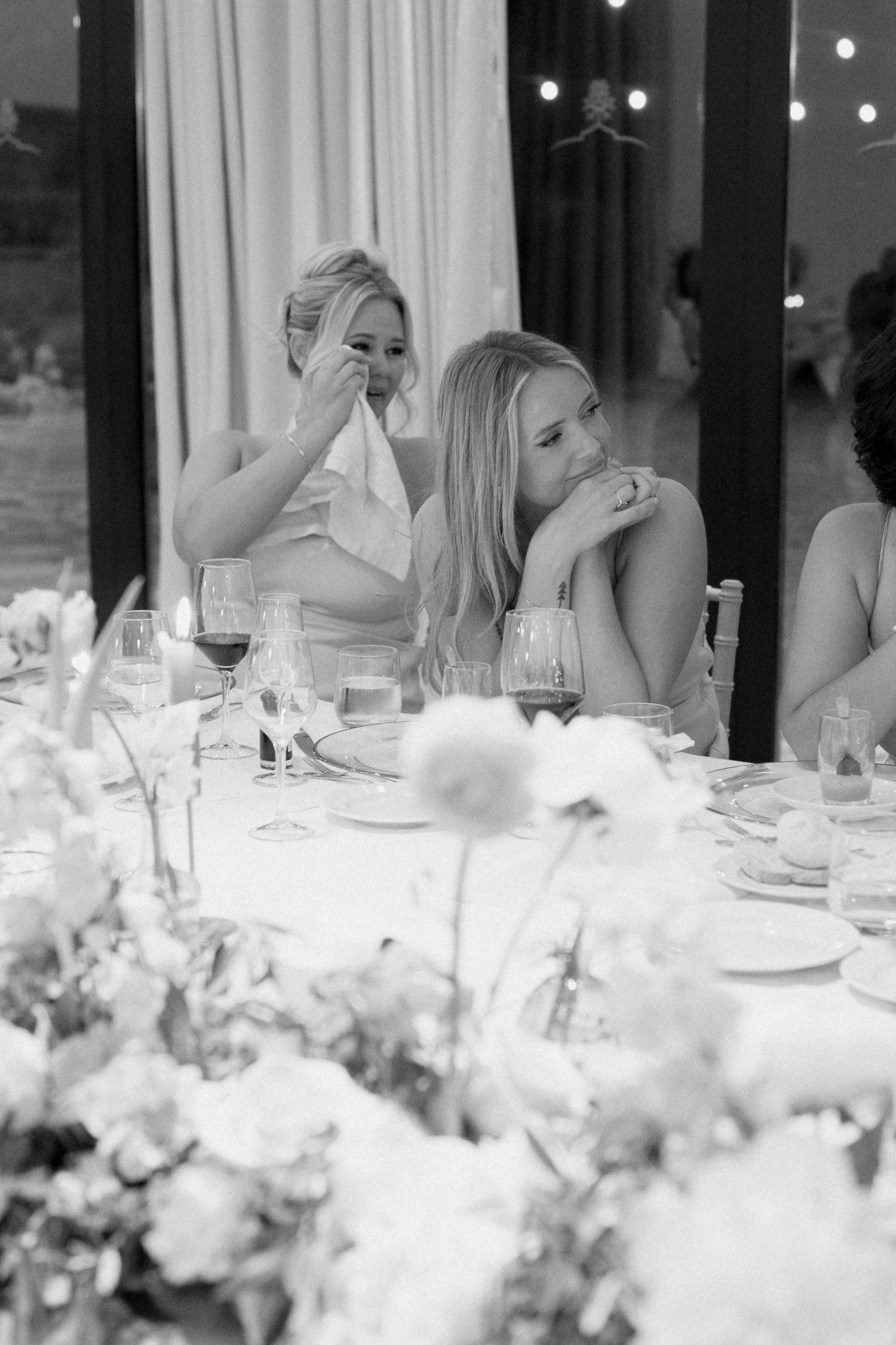 Wedding guest reacting emotionally during reception speech