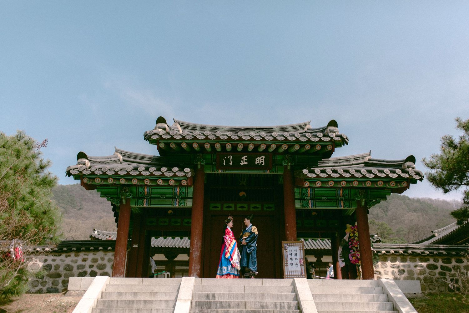 Couple wearing traditional Korean hanbok during wedding ceremony in Seoul, South Korea