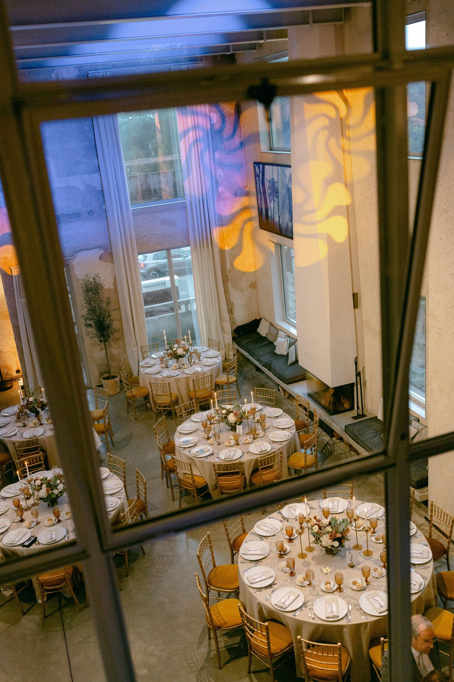 Aerial view of wedding reception hall with round tables
