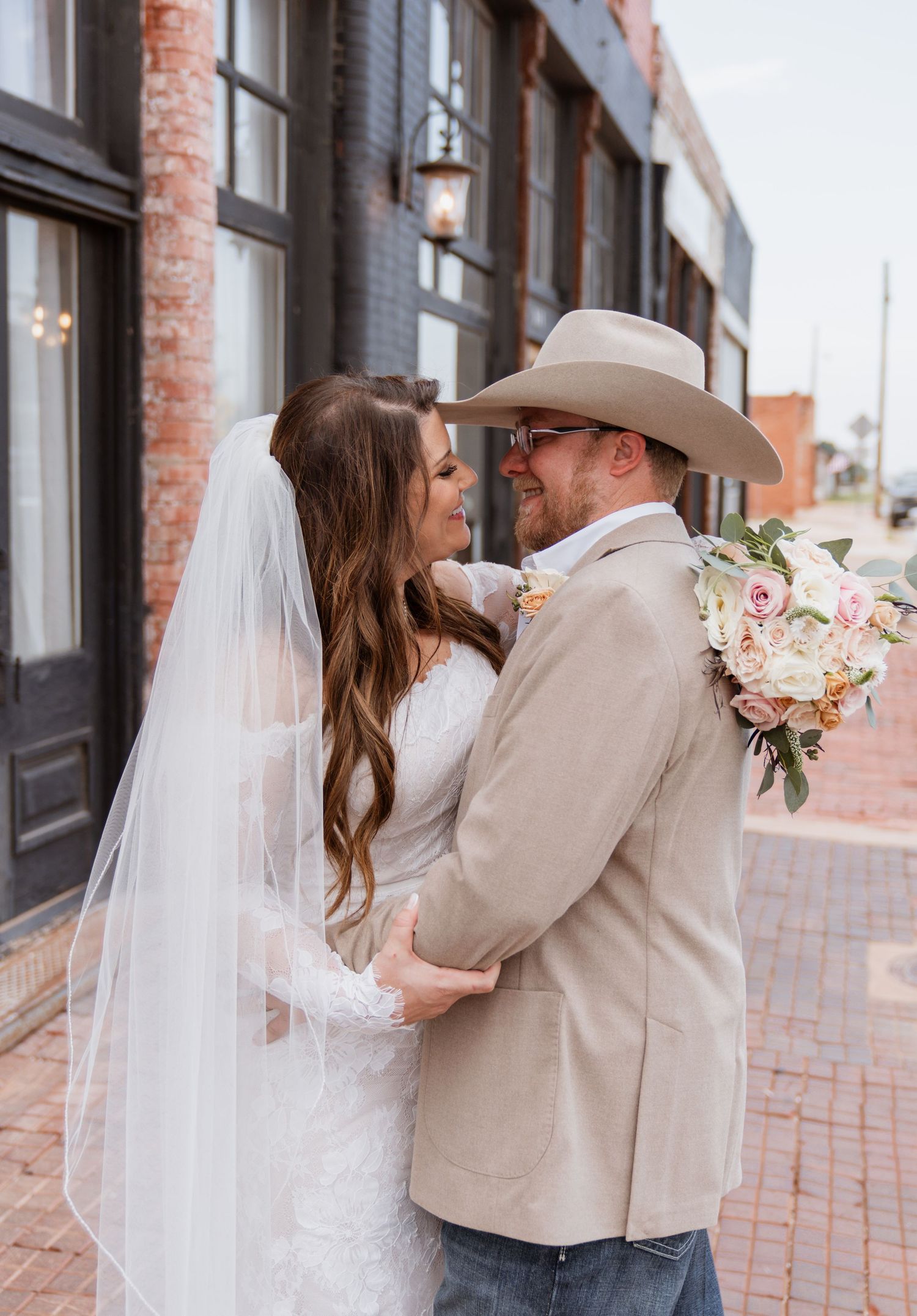 Sweet couple moments from indoor wedding in Merkel, Texas
