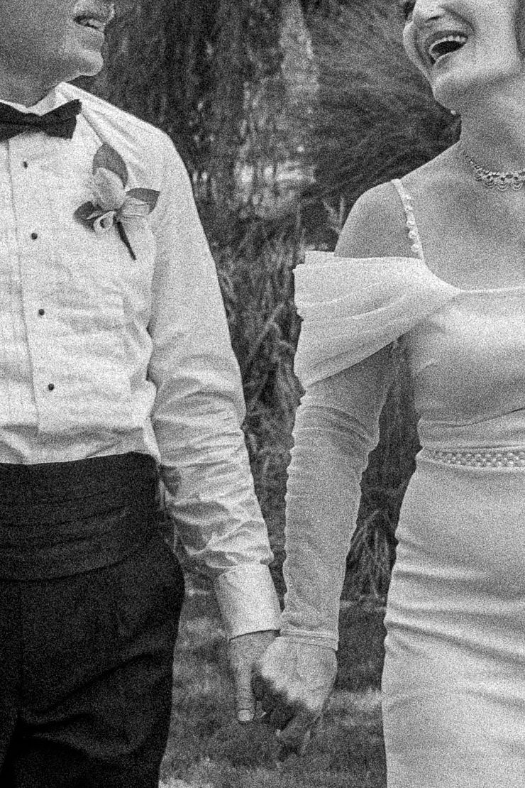 Nostalgic detail photo of couple walking together after their ceremony in Nampa, Idaho.
