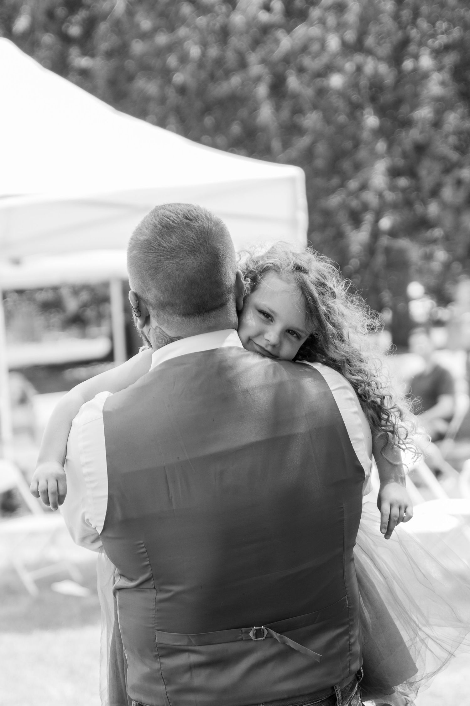 A groom shares an emotional dance with his young daughter at his wedding reception in Boise, Idaho.