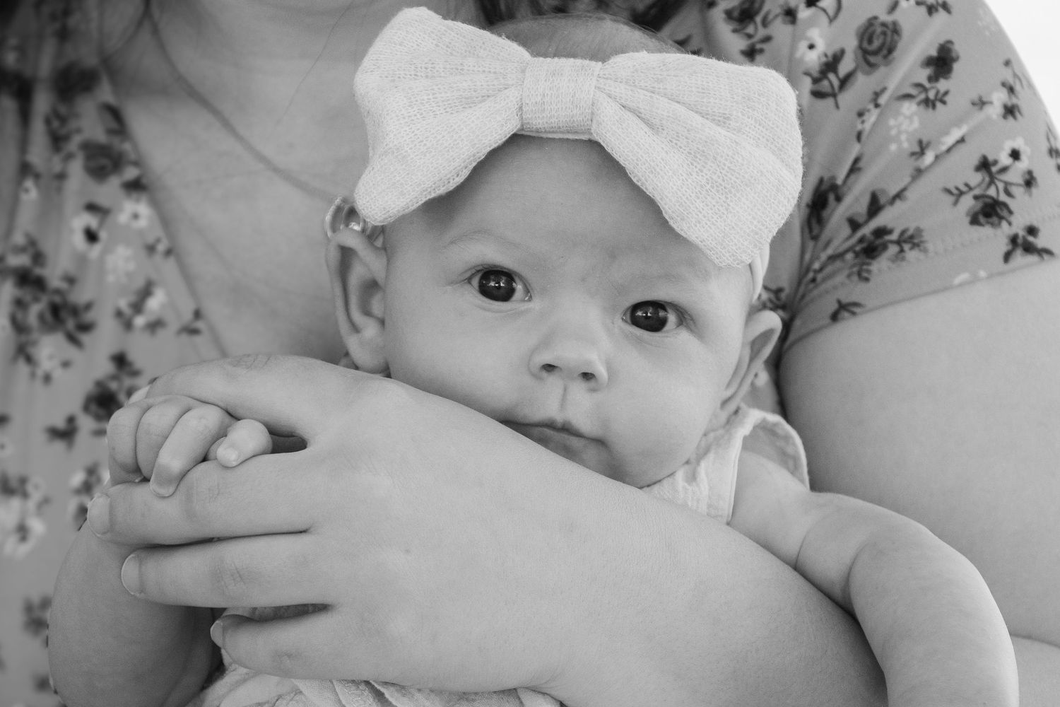 a little baby in moms arms in Nampa idaho