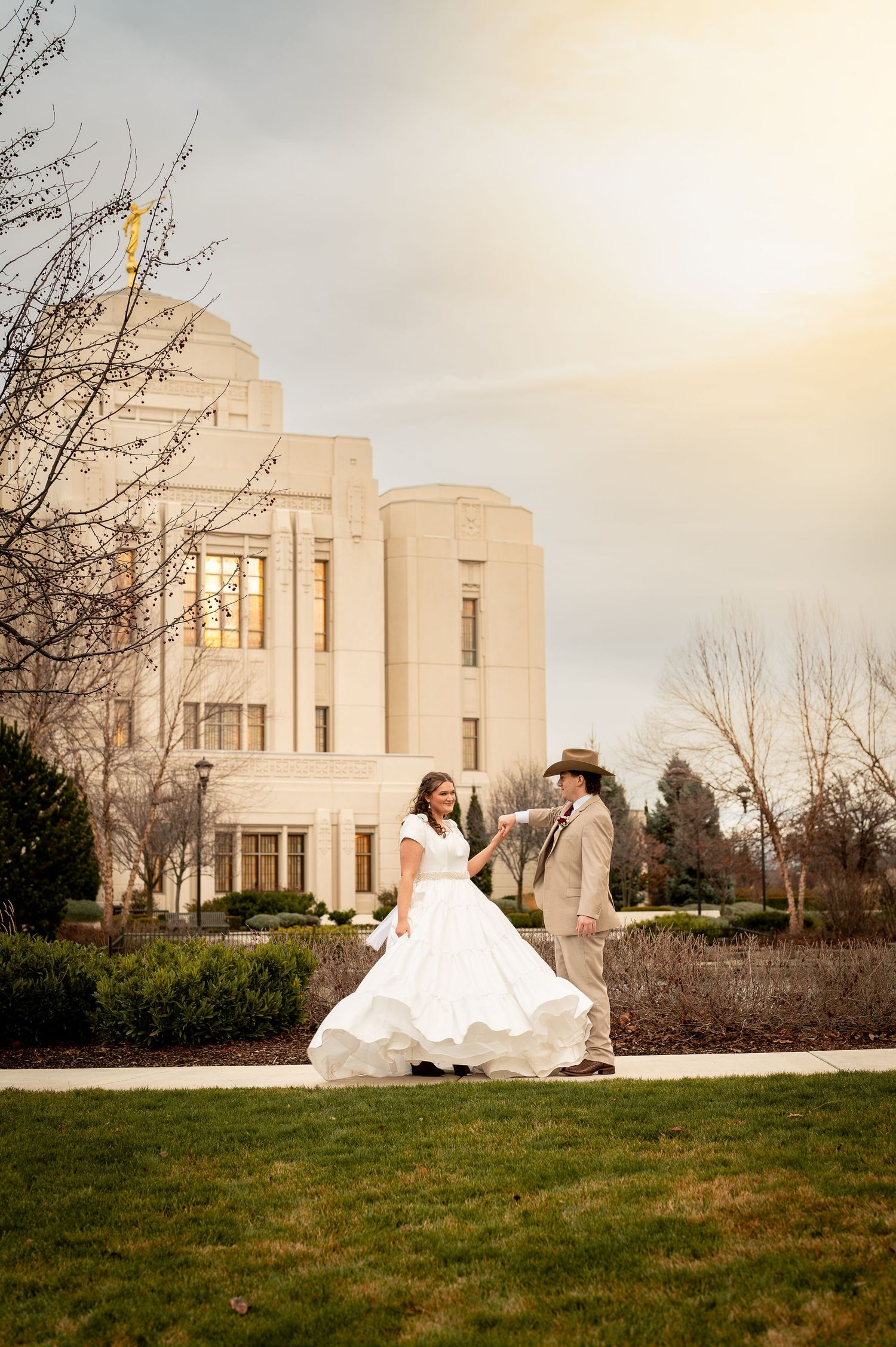 A newly married couple dancing outside the LDS Meridian Idaho Temple