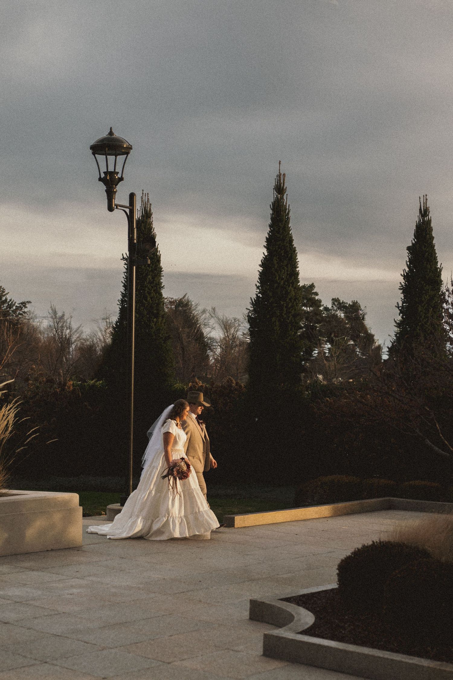 A newly married walking outside the LDS Meridian Idaho Temple