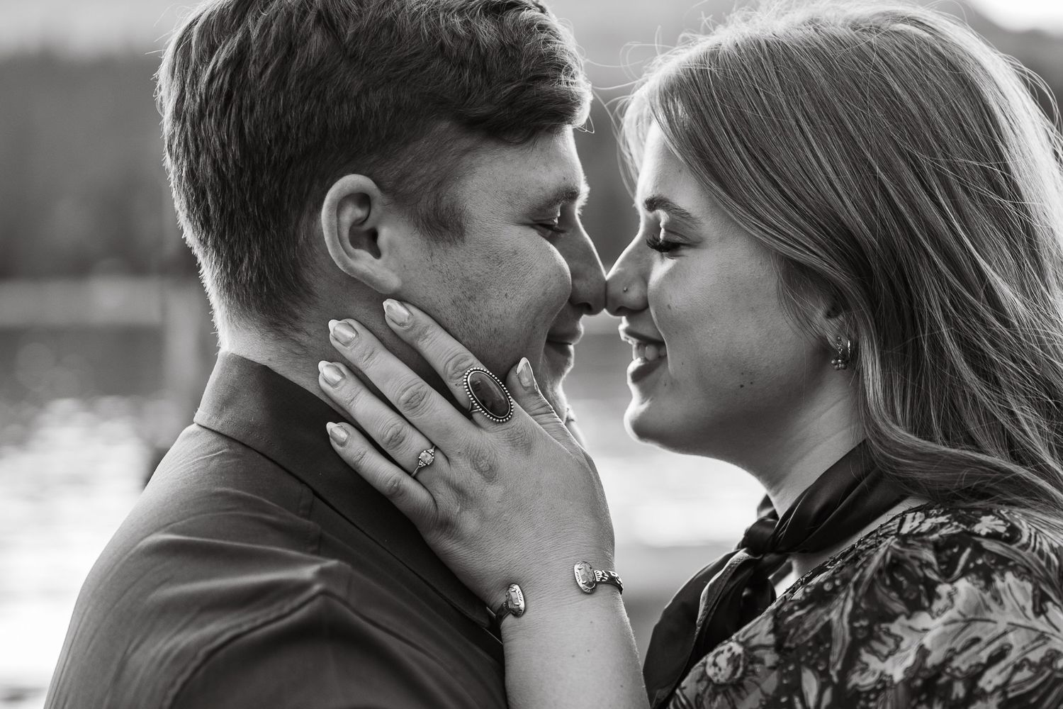 a detail shot of a couple kissing at redfish lake in Stanley, idaho