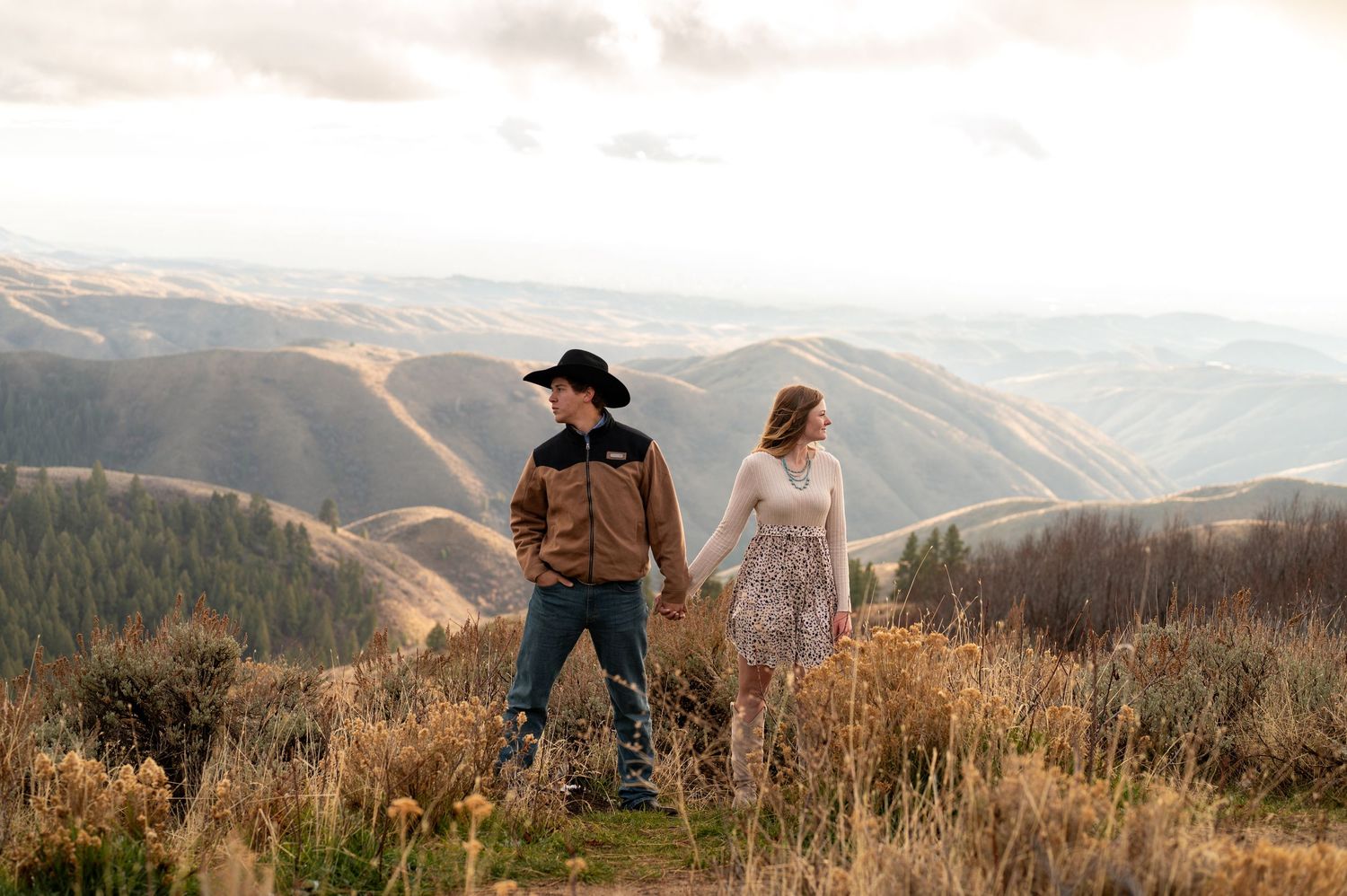A dramatic photo of a couple in front of mountain views in Boise, Idaho.