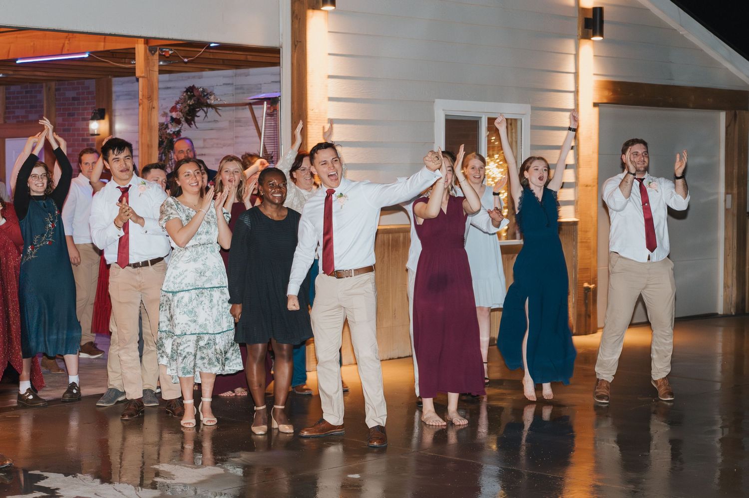 Friends cheering for the newlyweds as they leave the party in Kuna, Idaho