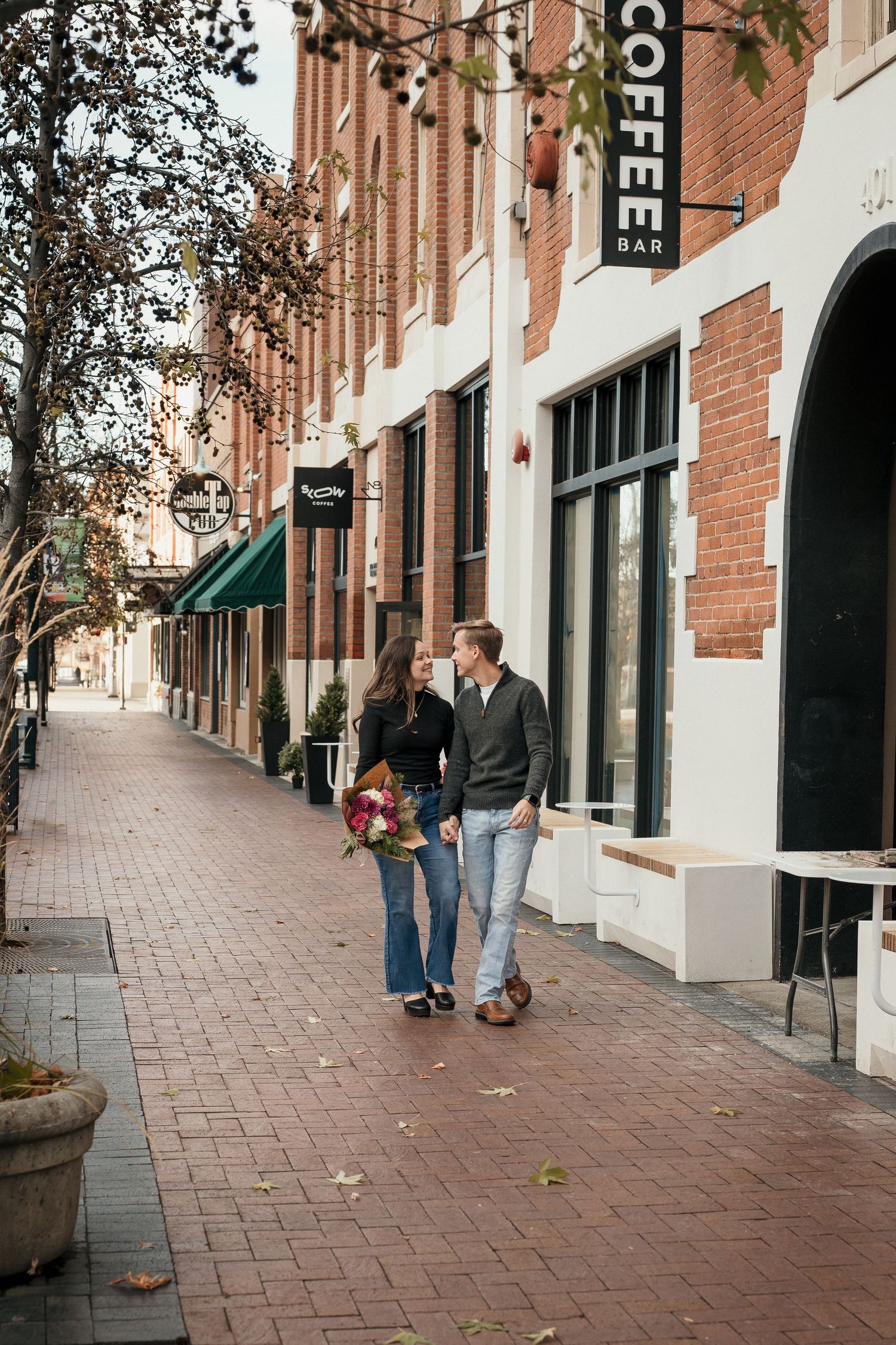 A couple walking together on the streets of downtown Boise, Idaho.