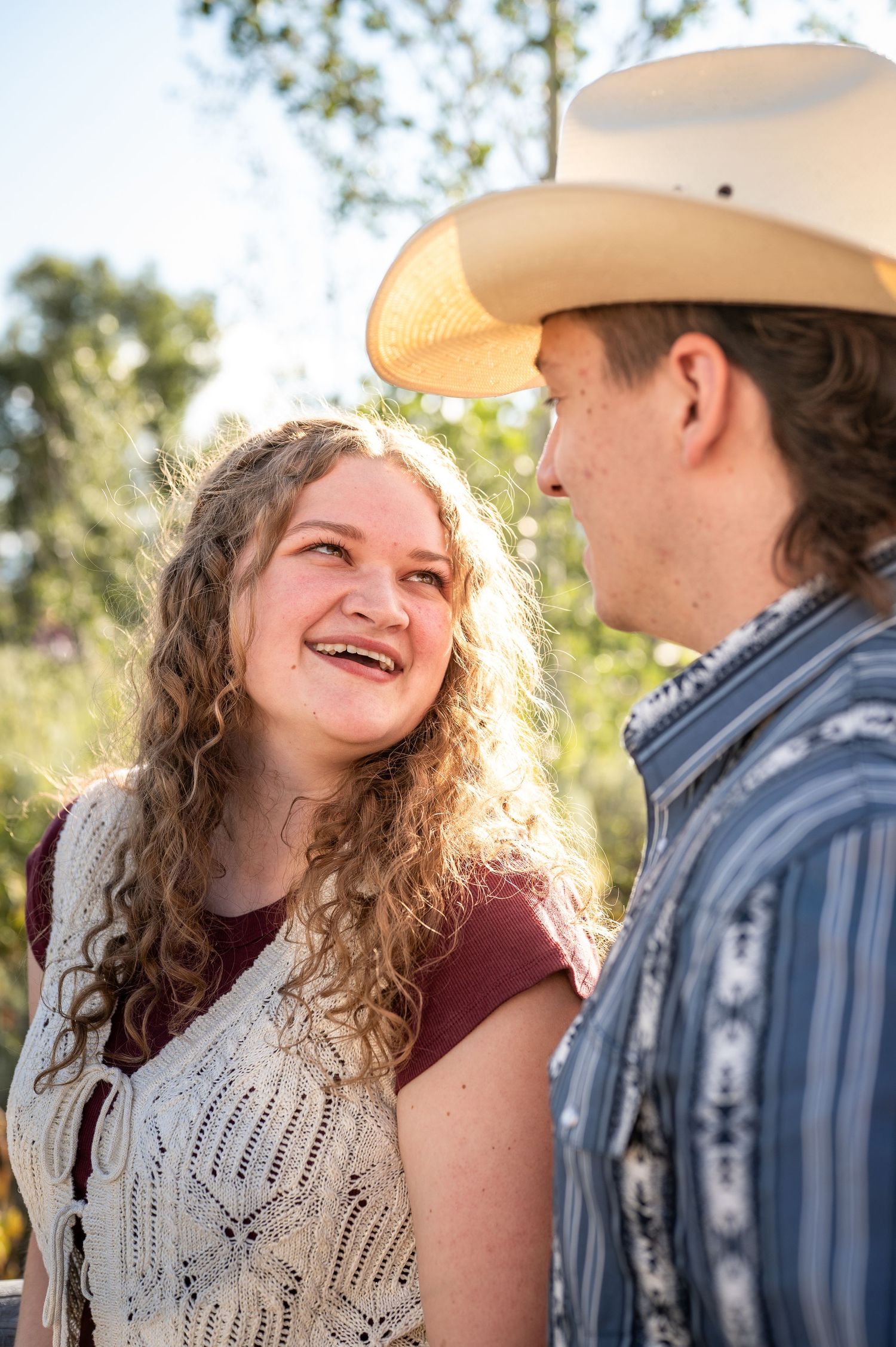 A girl looks up at her fiancé in Grand Teton National Park.