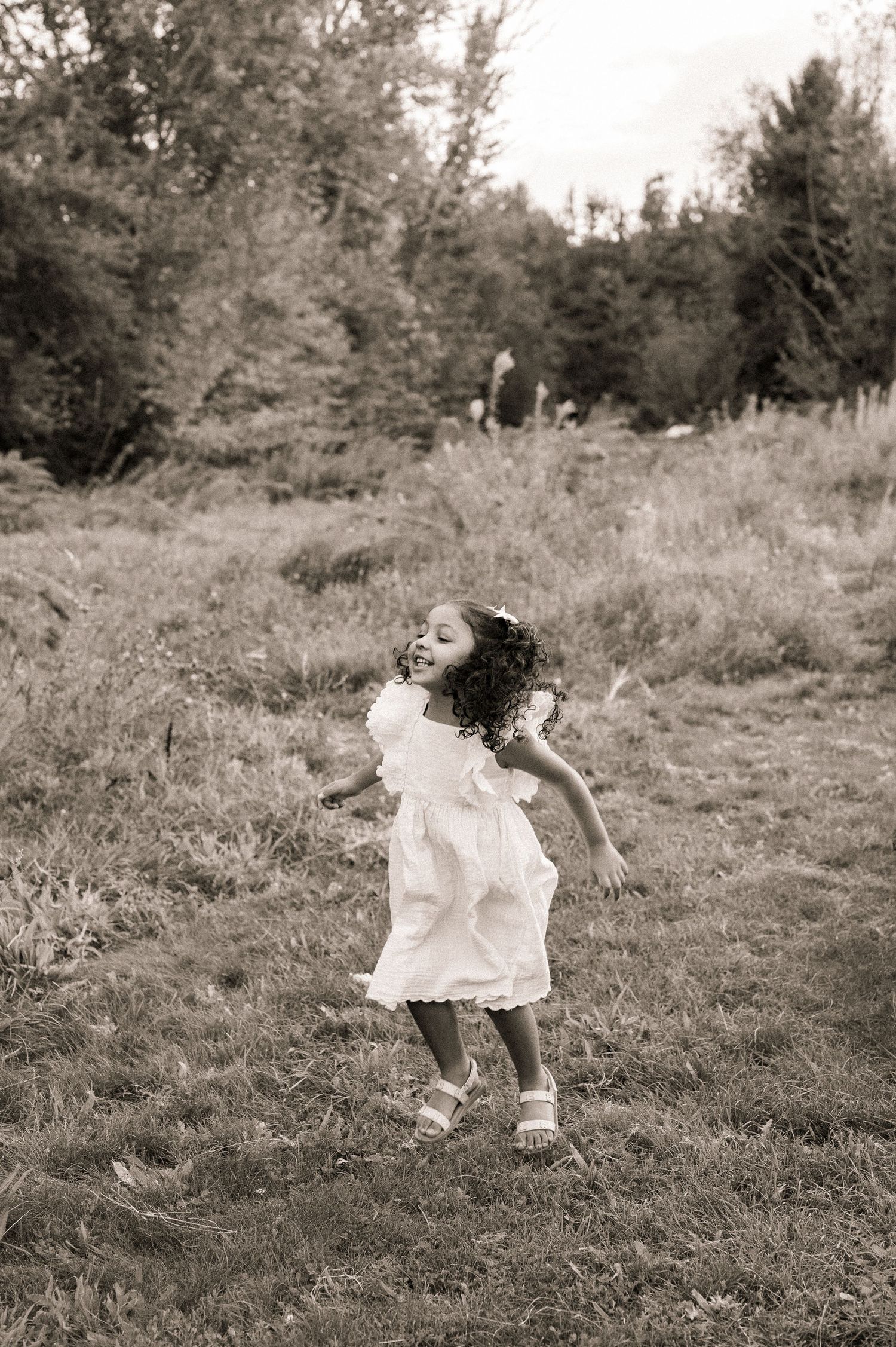 A little girl jumping during her photoshoot in boise idaho