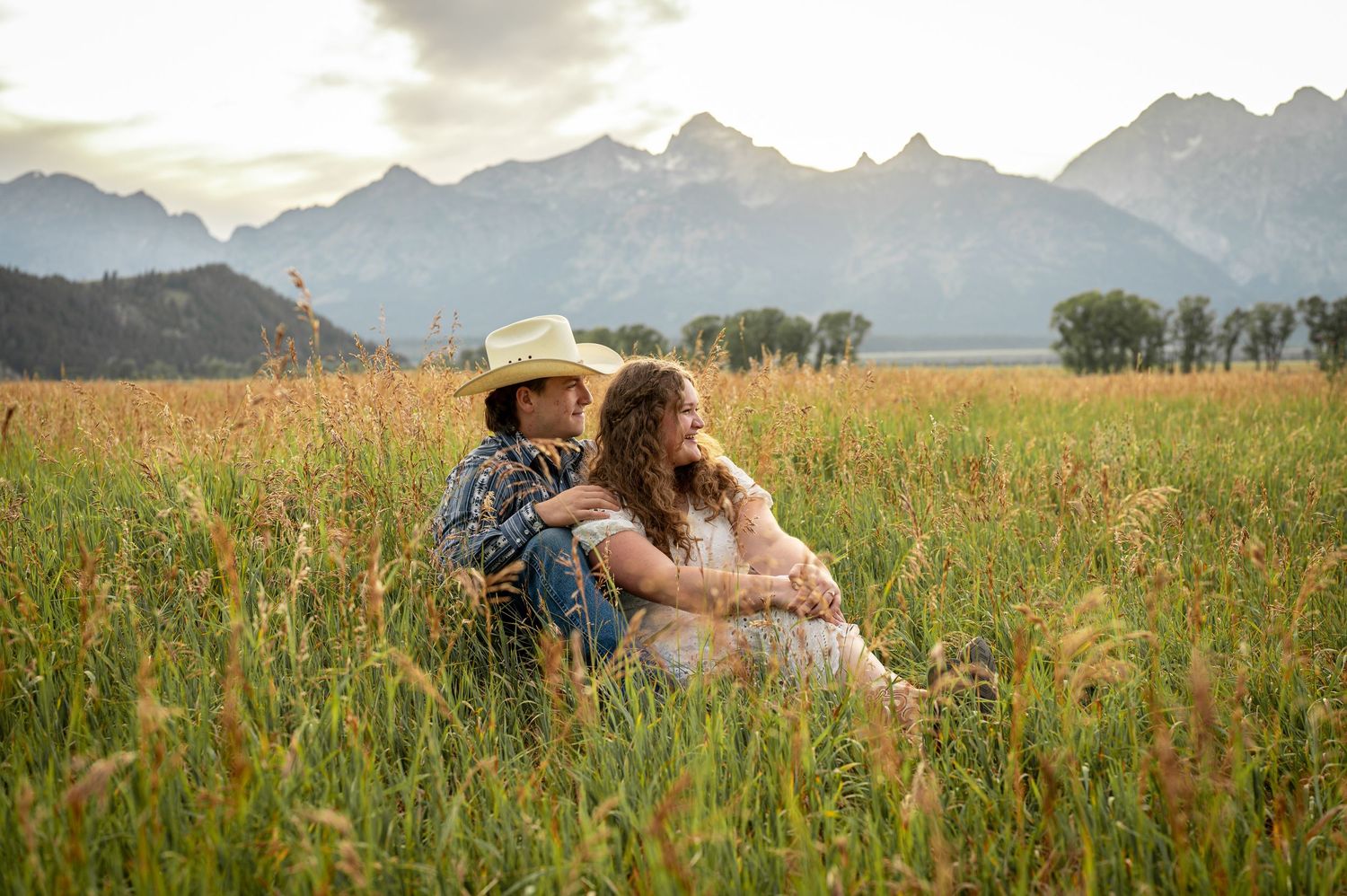 a couple posing at mormon row in grand Teton national park.