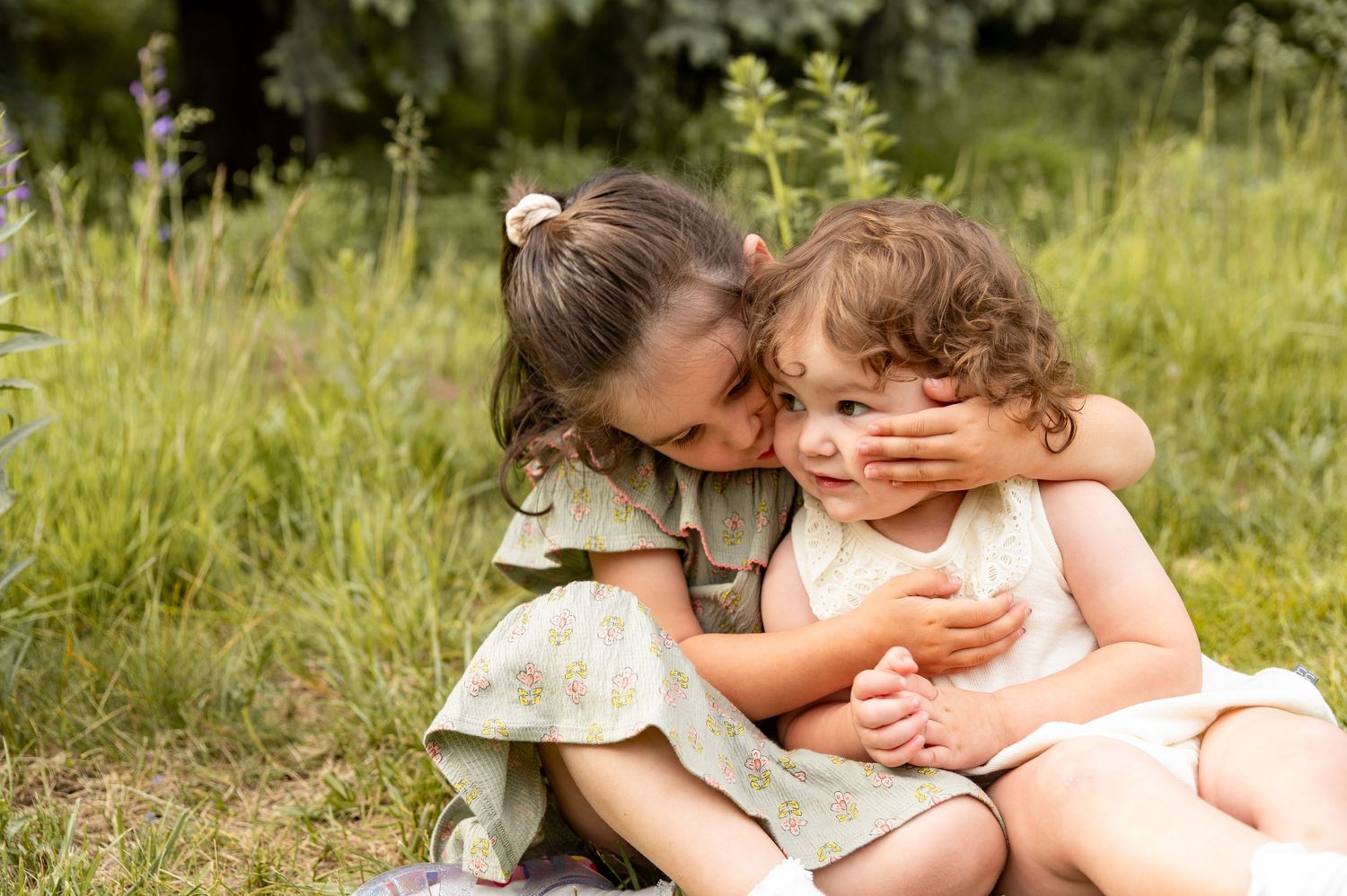 two little sisters snuggling up together in boise idaho