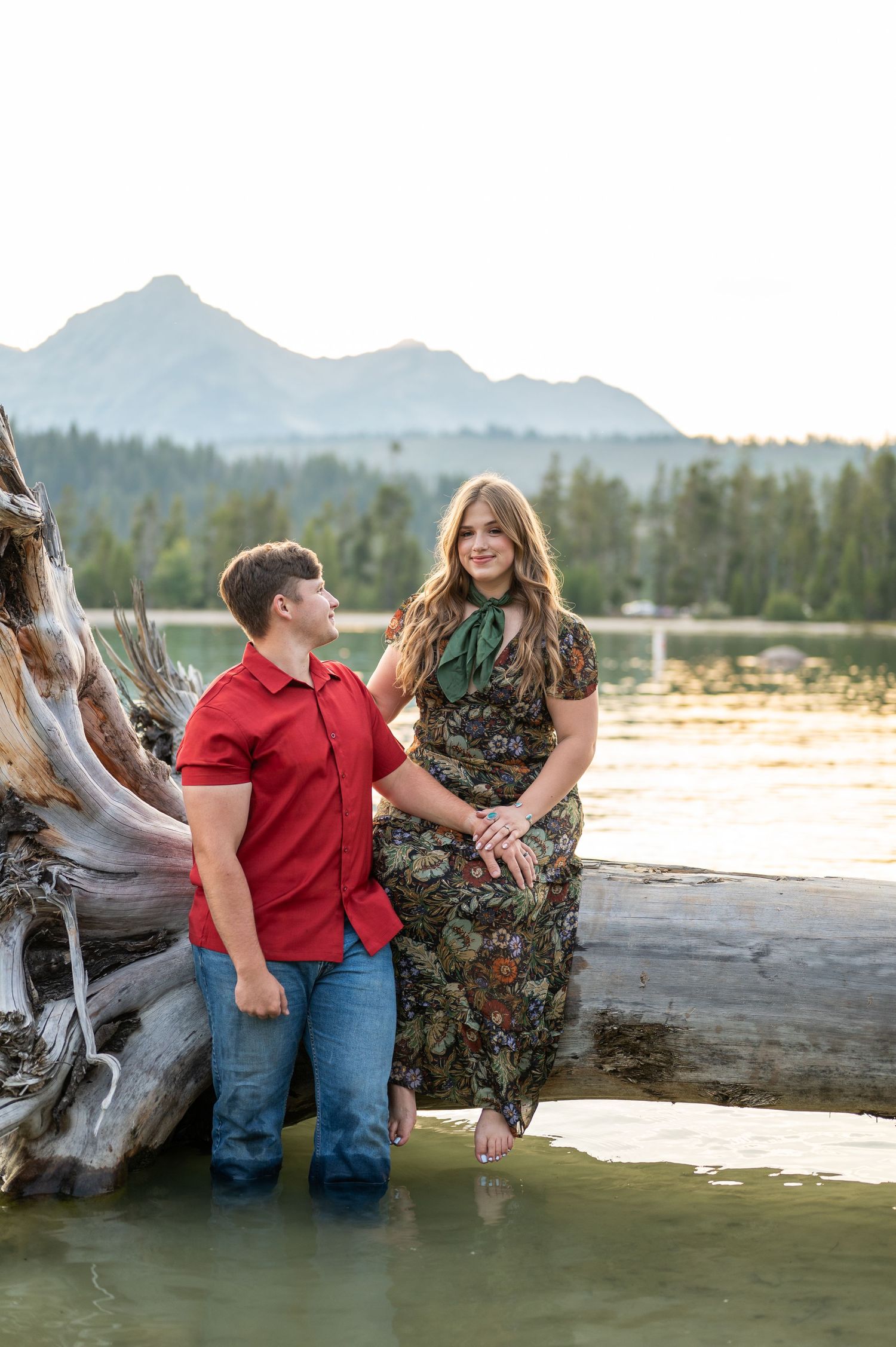 A couple at Redfish lake in front of the Sawtooth mountains.
