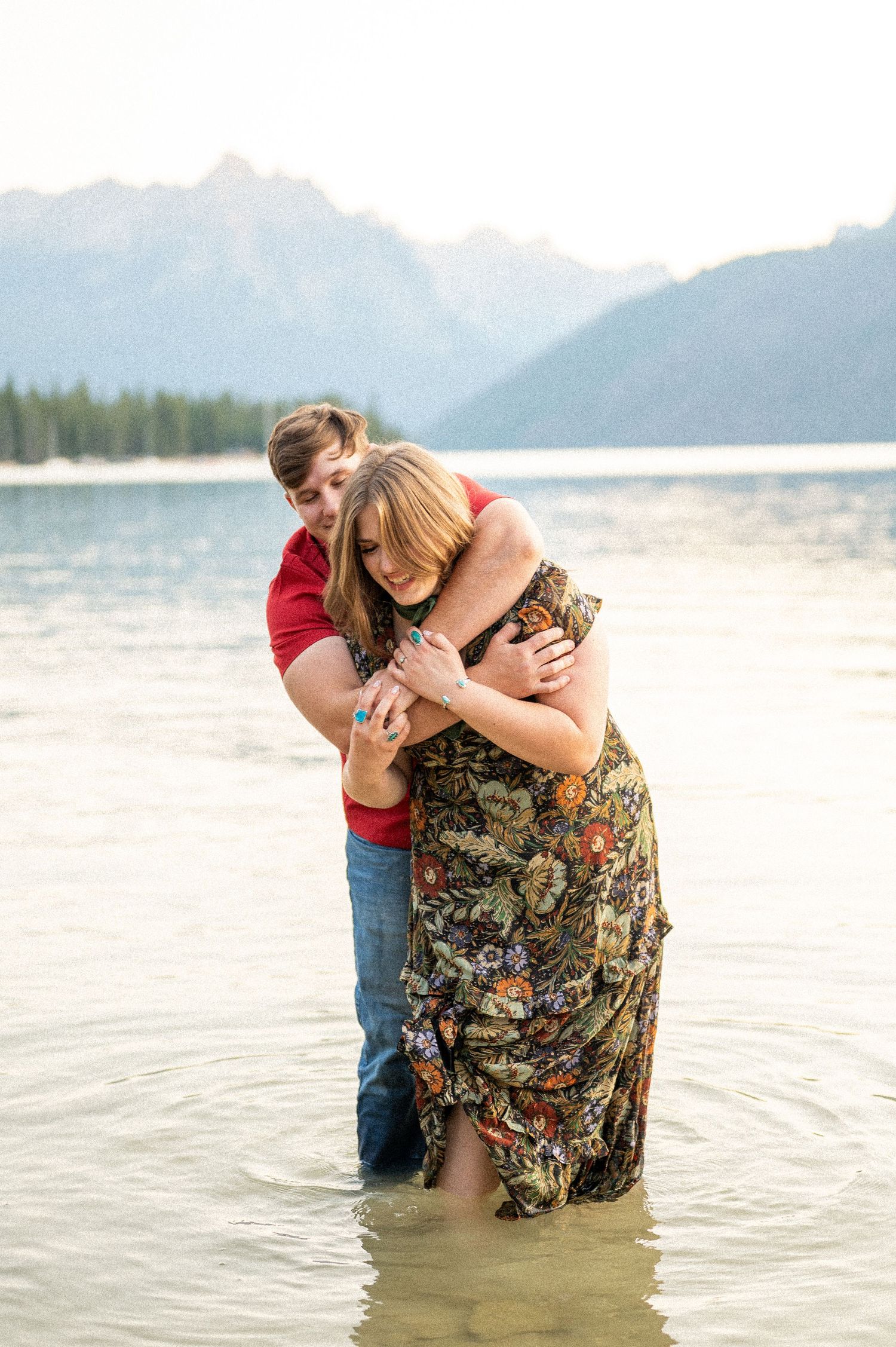A couple hugging in Redfish lake of Stanley, Idaho.