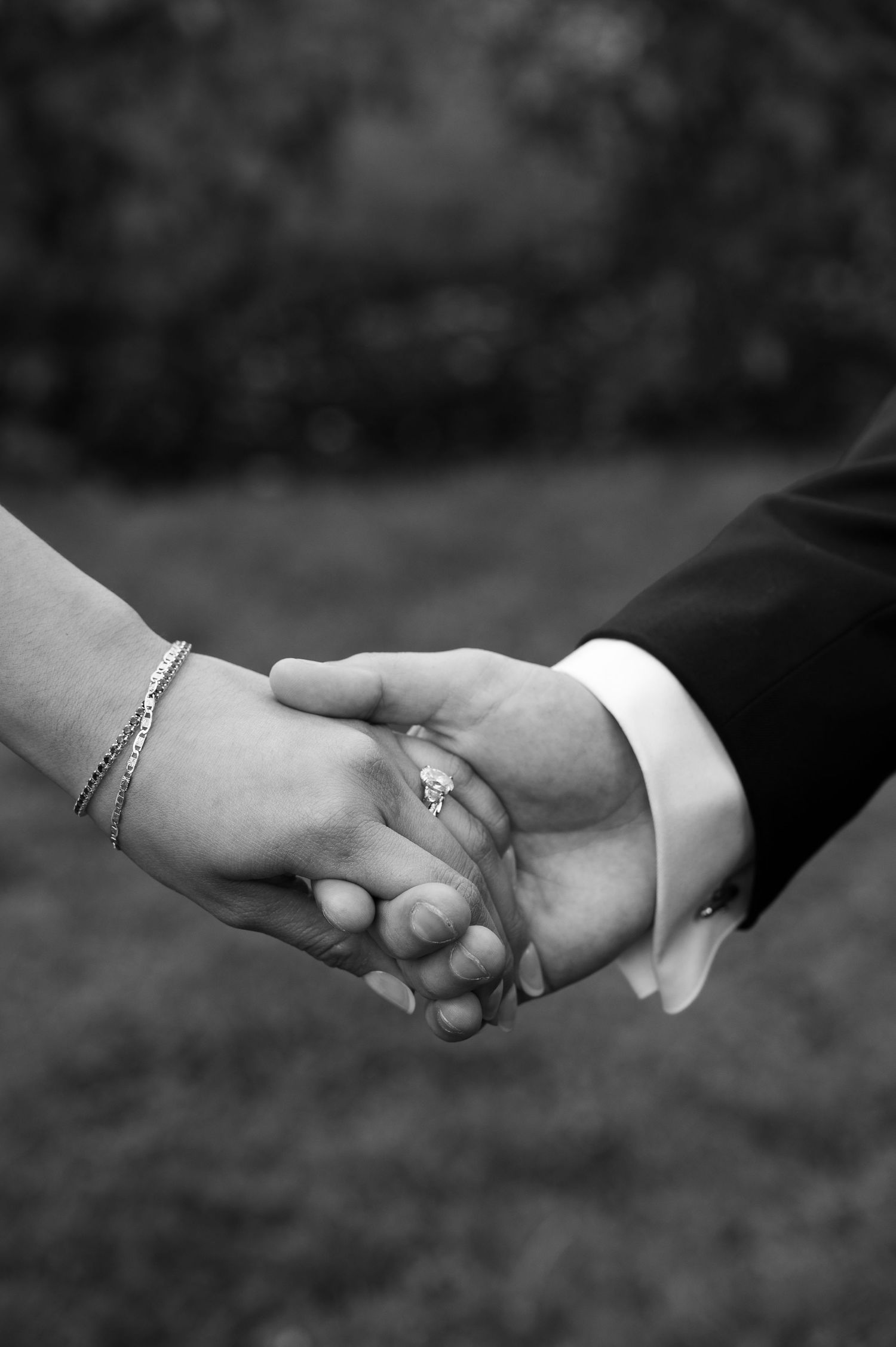 A detail shot of a new bride and groom holding hands in Boise, Idaho.