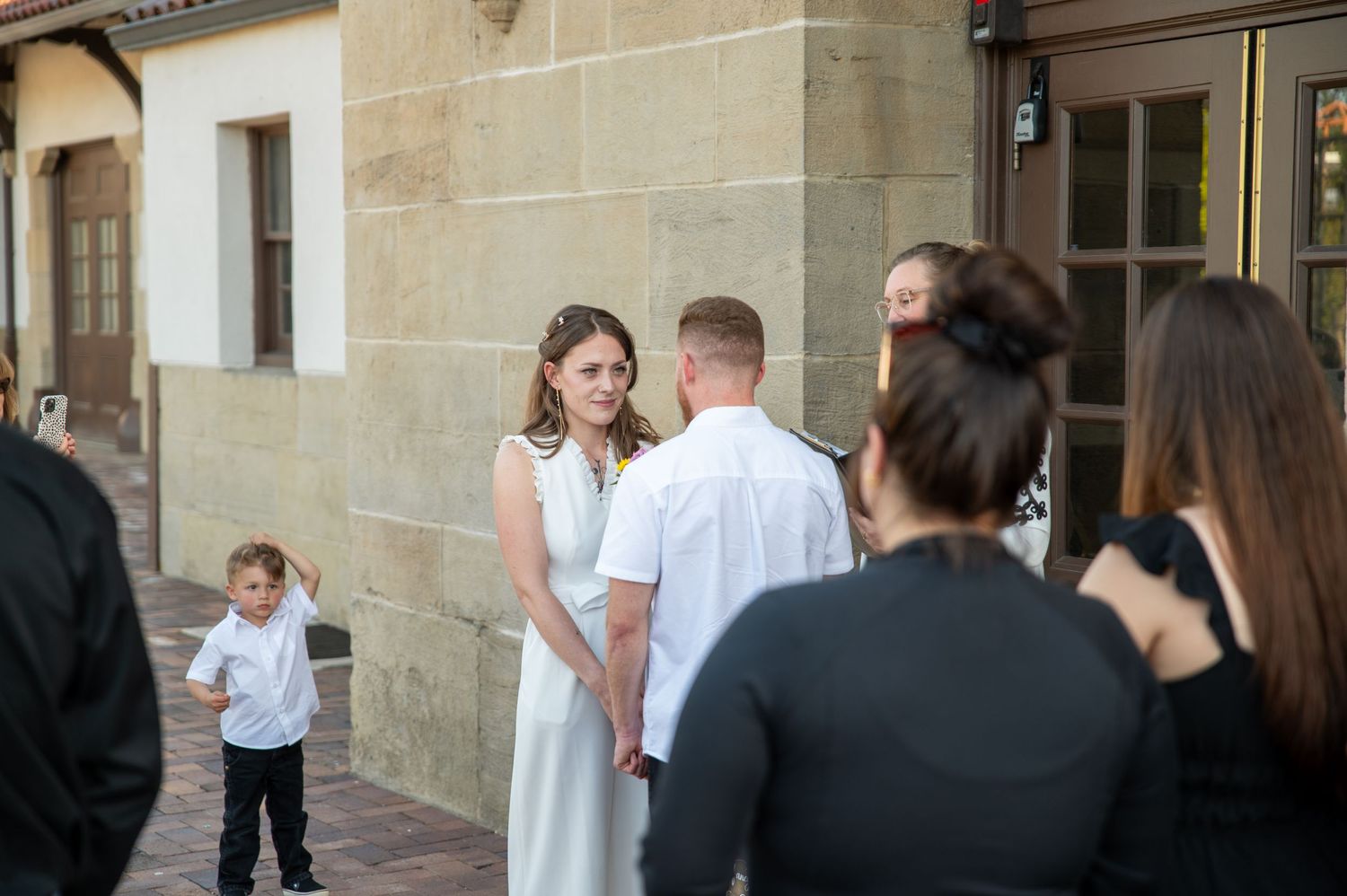 An emotional look between bride and groom during their wedding ceremony at the Boise Train Depot in Boise, Idaho.