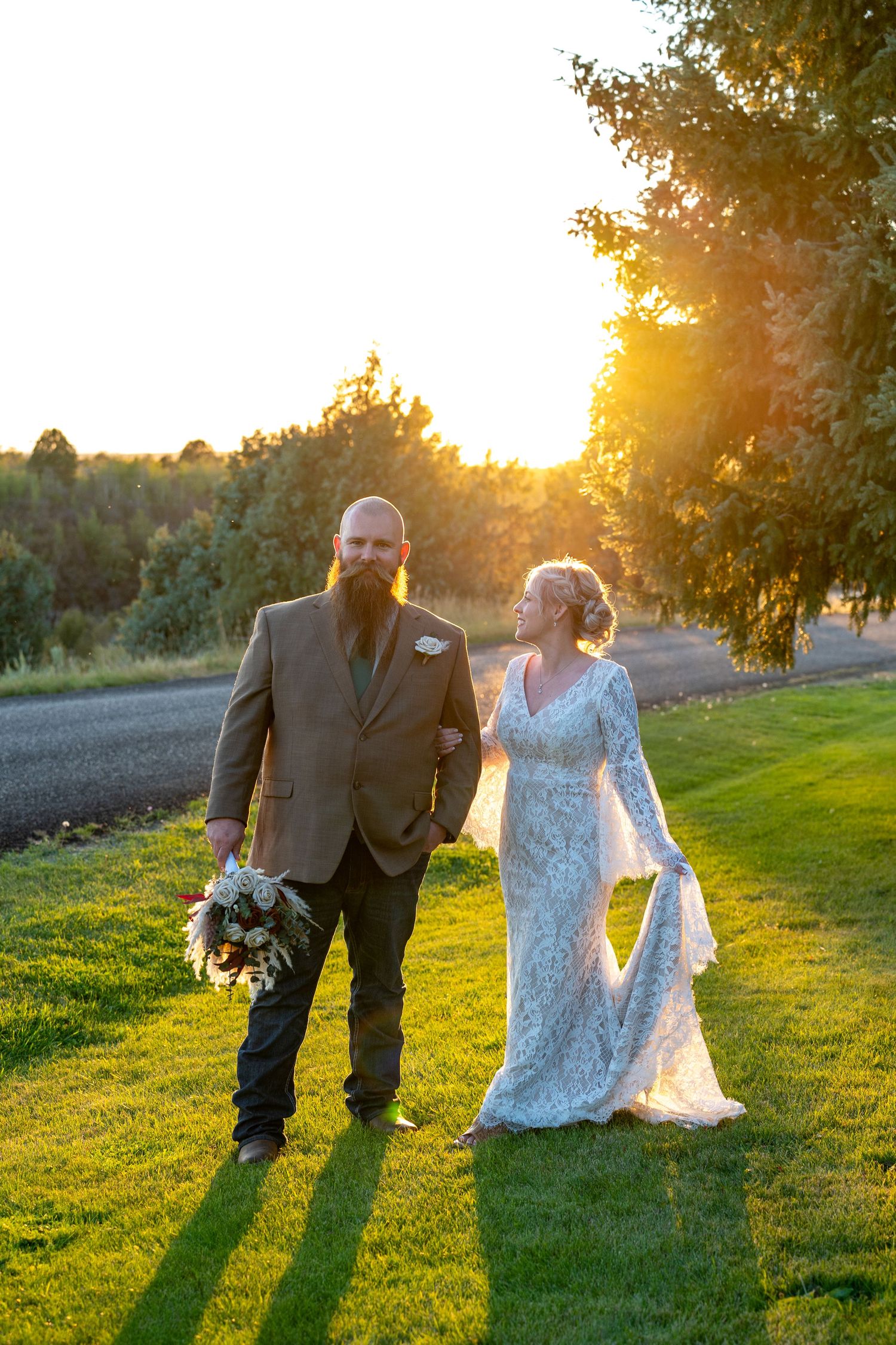 A bride and groom at golden hour in Ashton, Idaho after eloping in Grand Teton National Park.