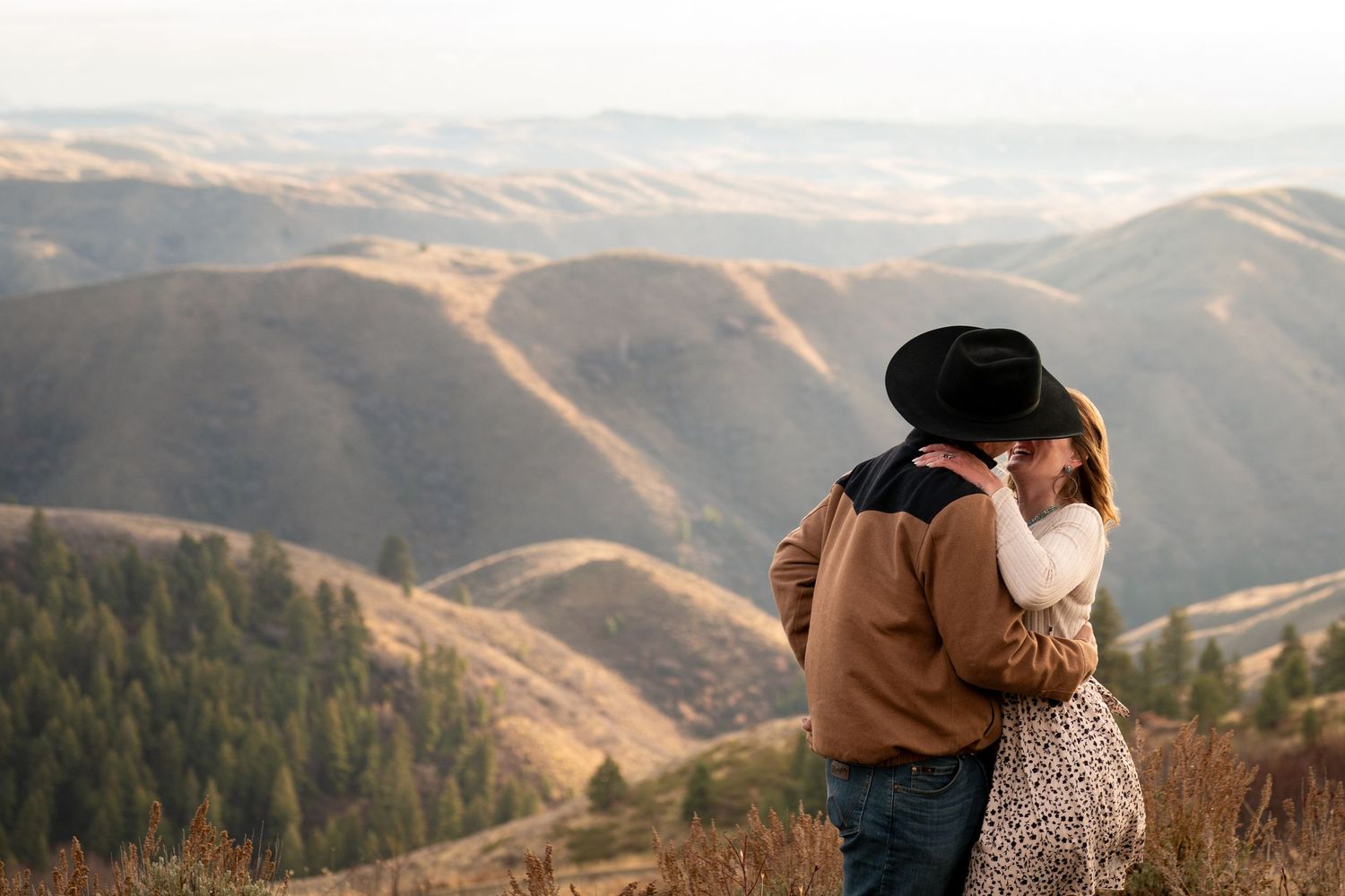 A couple laughing together with crazy mountain views in Boise, Idaho.