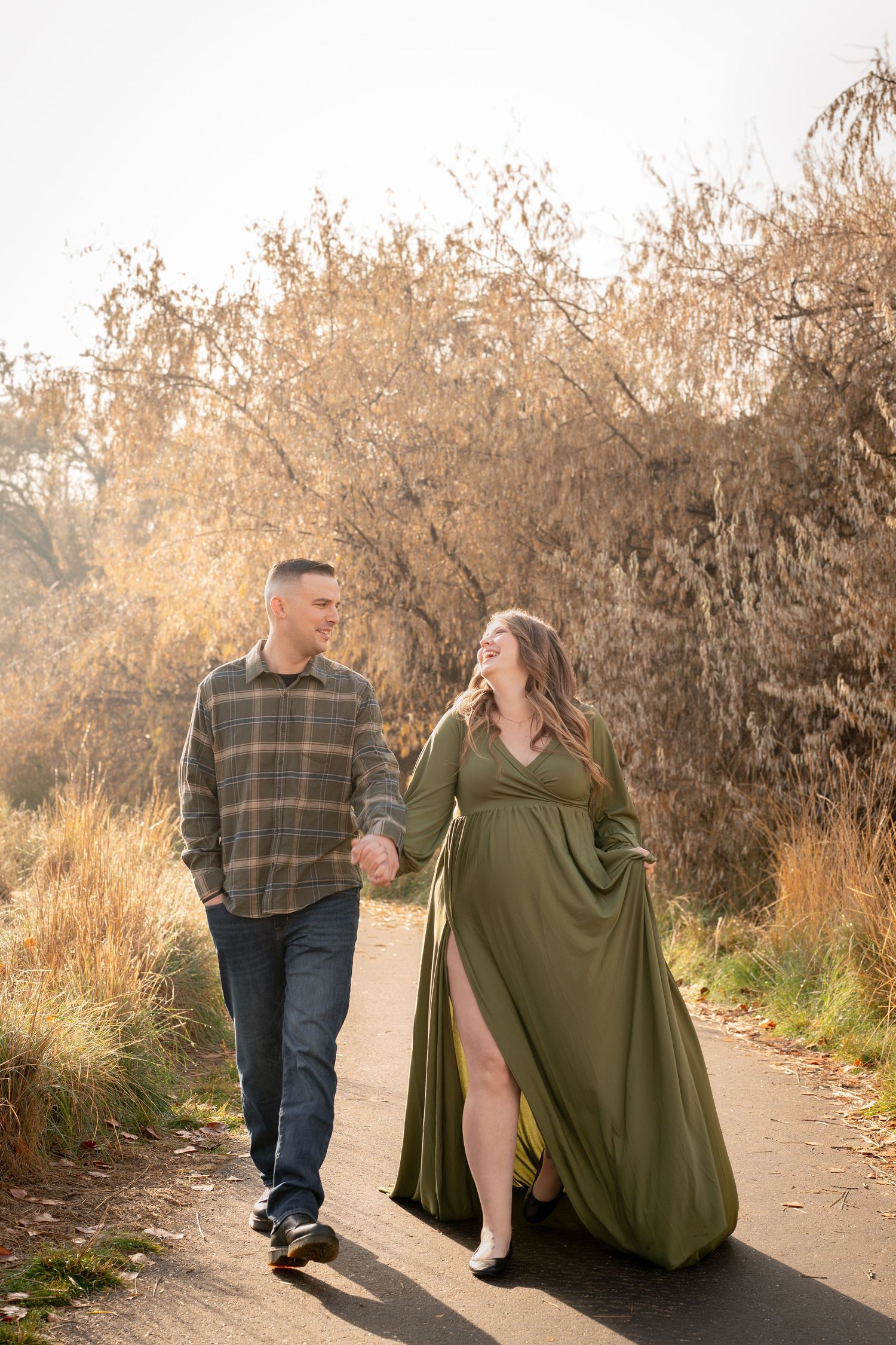 a pregnant woman and her husband walking together in Nampa idaho