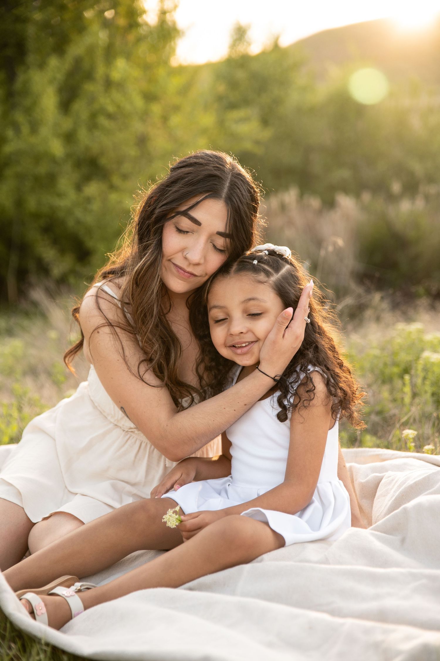 a mom and her daughter at golden hour in boise idaho