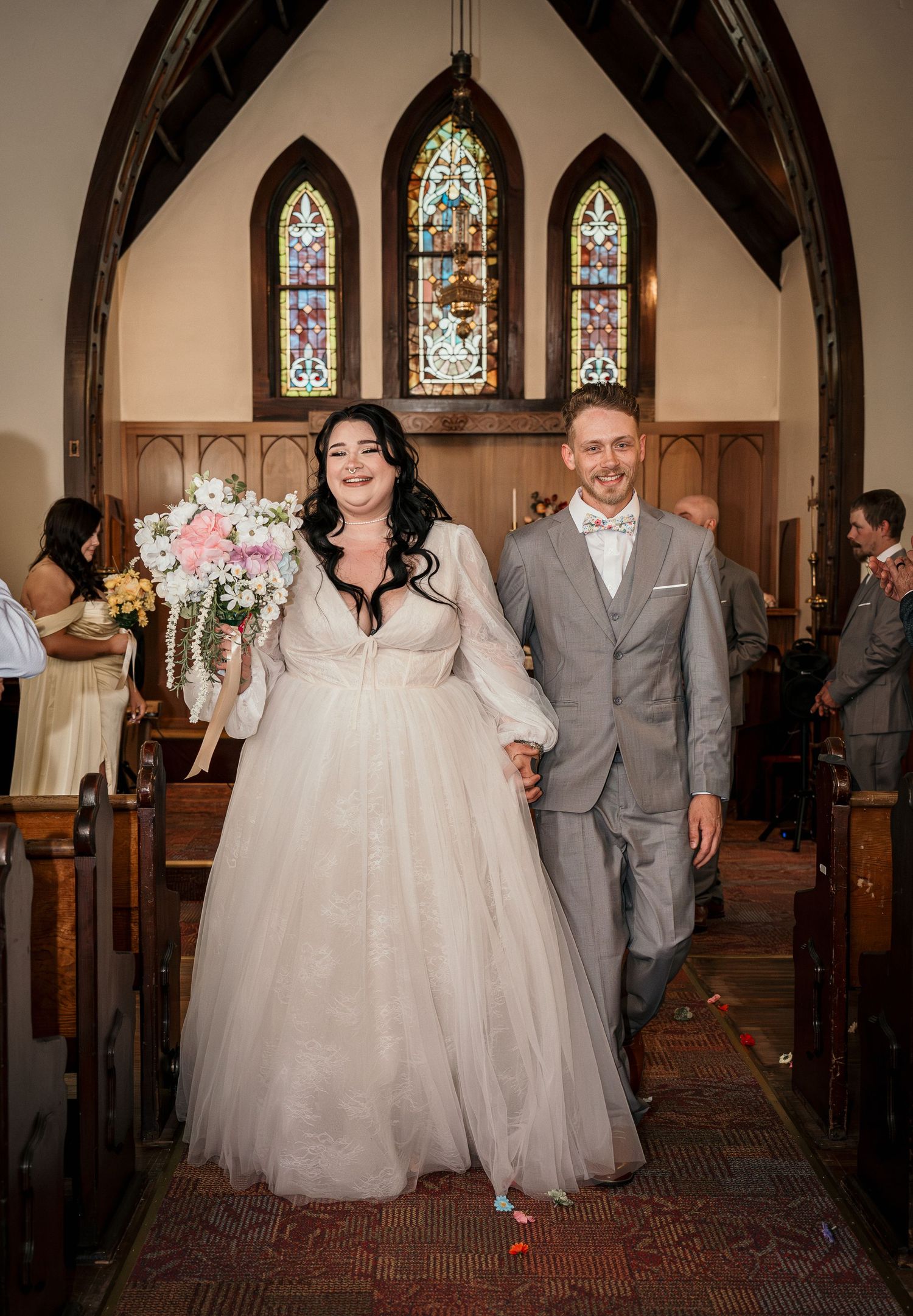 A bride and groom leaving the church after their ceremony in Payette, Idaho.