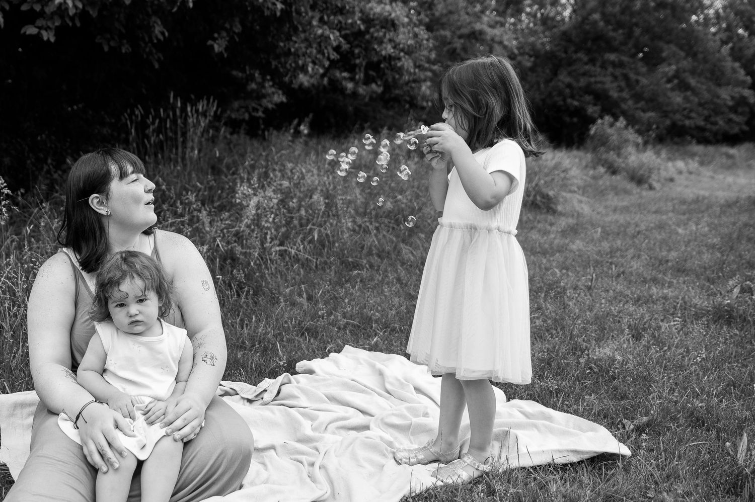 a candid moment with a mom and her two daughters in boise idaho