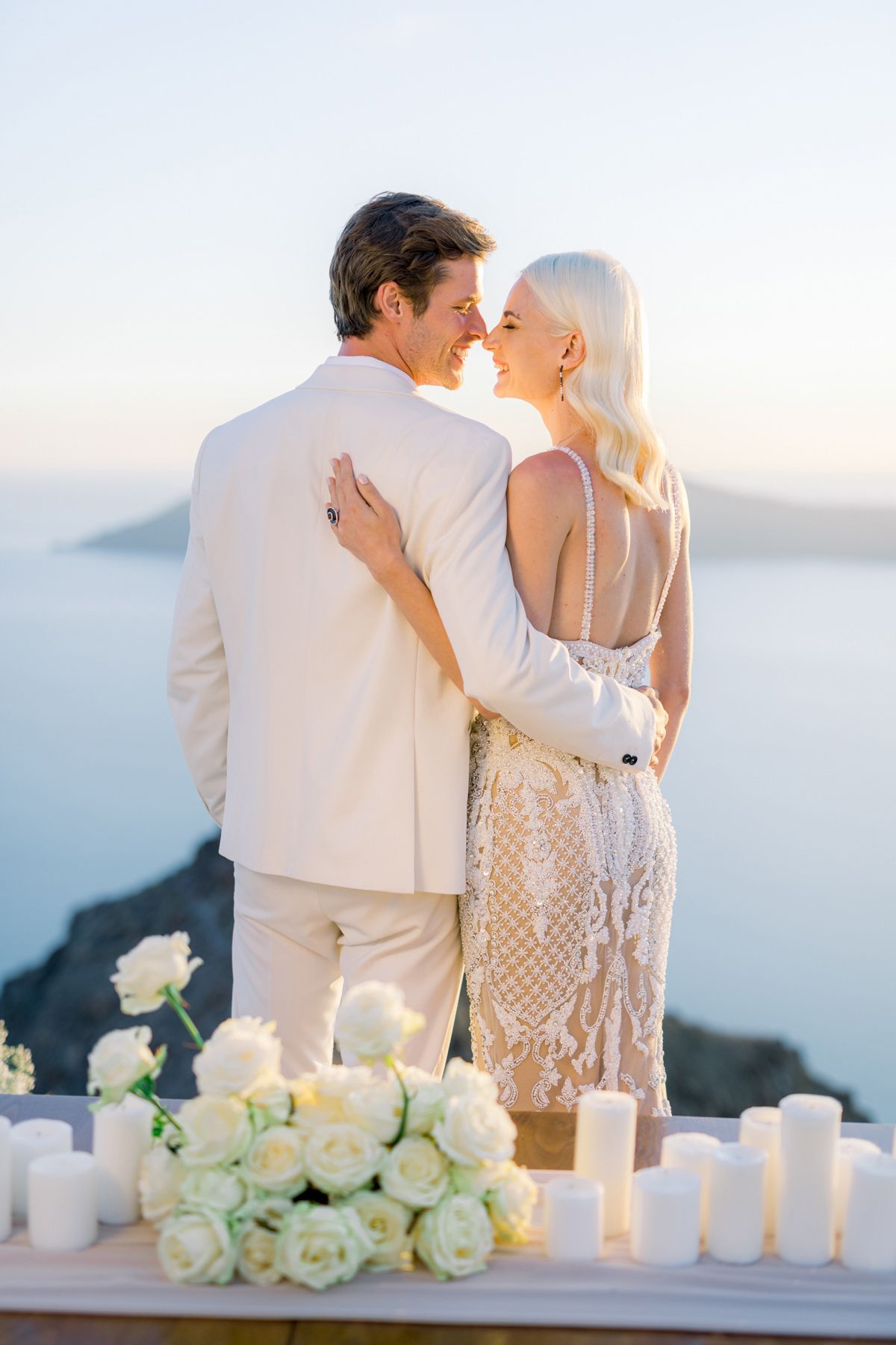 Destination wedding on a Greek island with elegant couple portraits and sea view in Greece